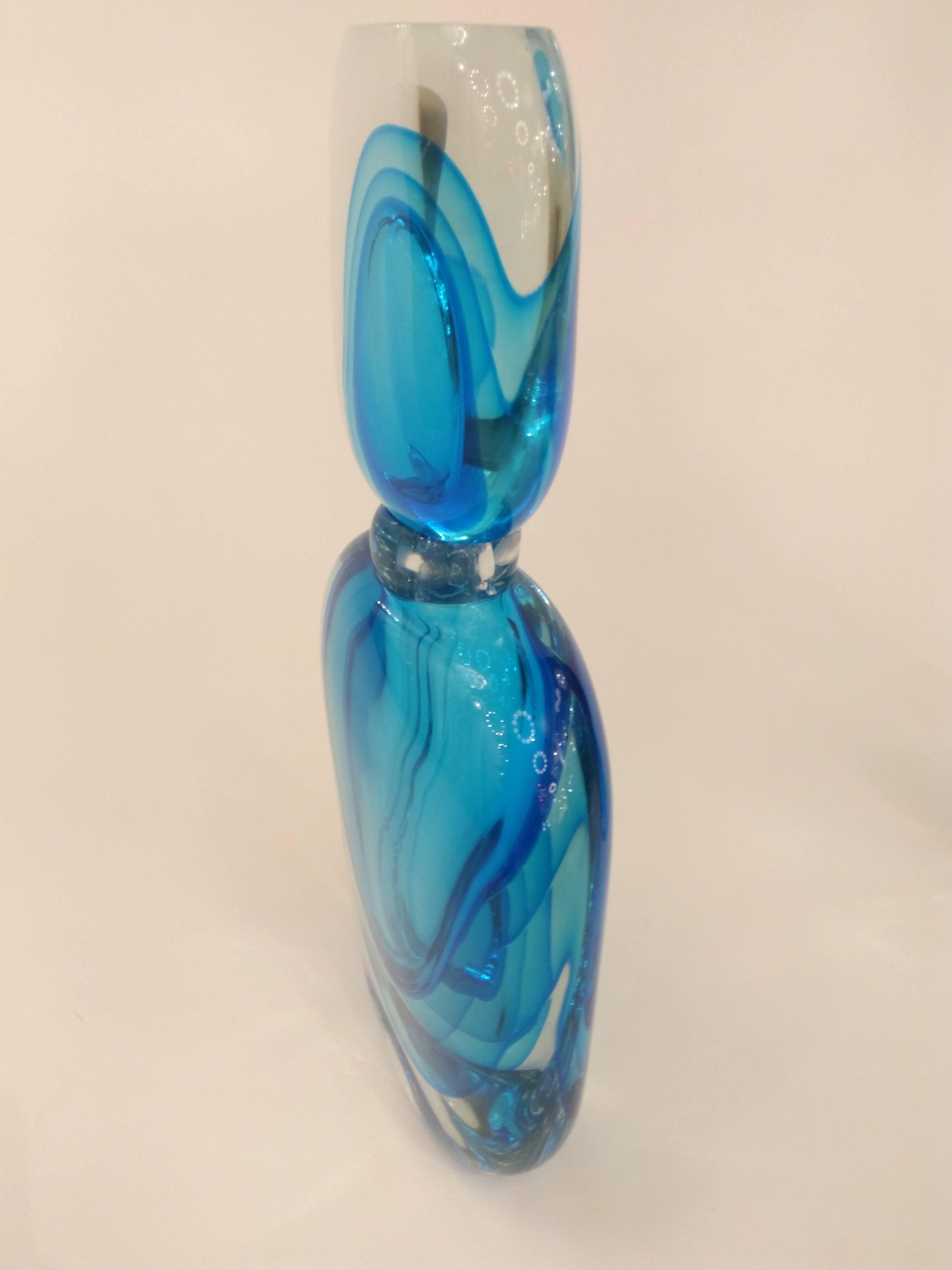 A rare oversized bottle with drop stoppers in Murano glass. Beautiful and sophisticated decoration with the Sommerso technique, the clear body encased with three layers of blue.
