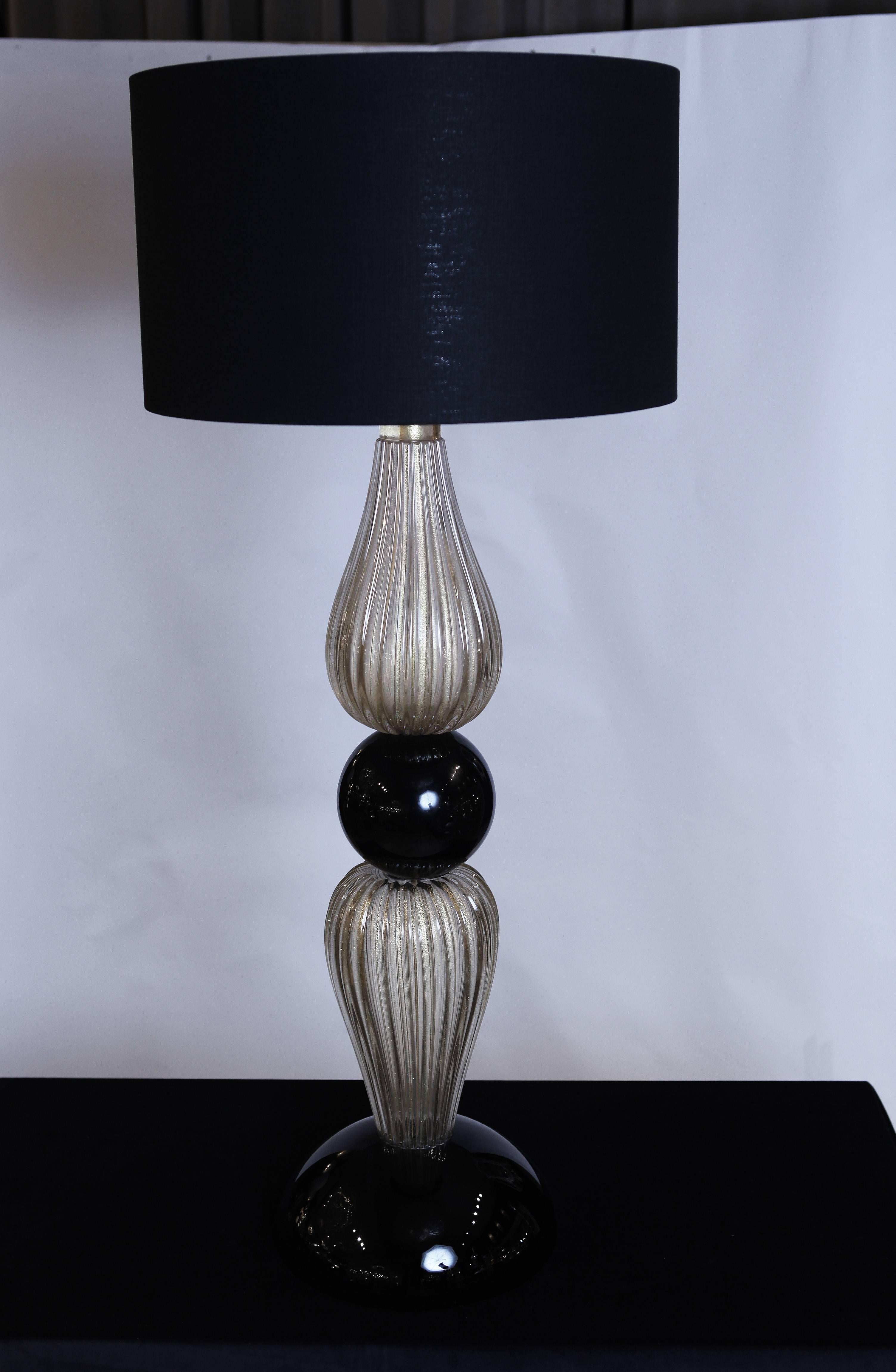 A stunning pair of venetian glass table lamps with gold inclusions.