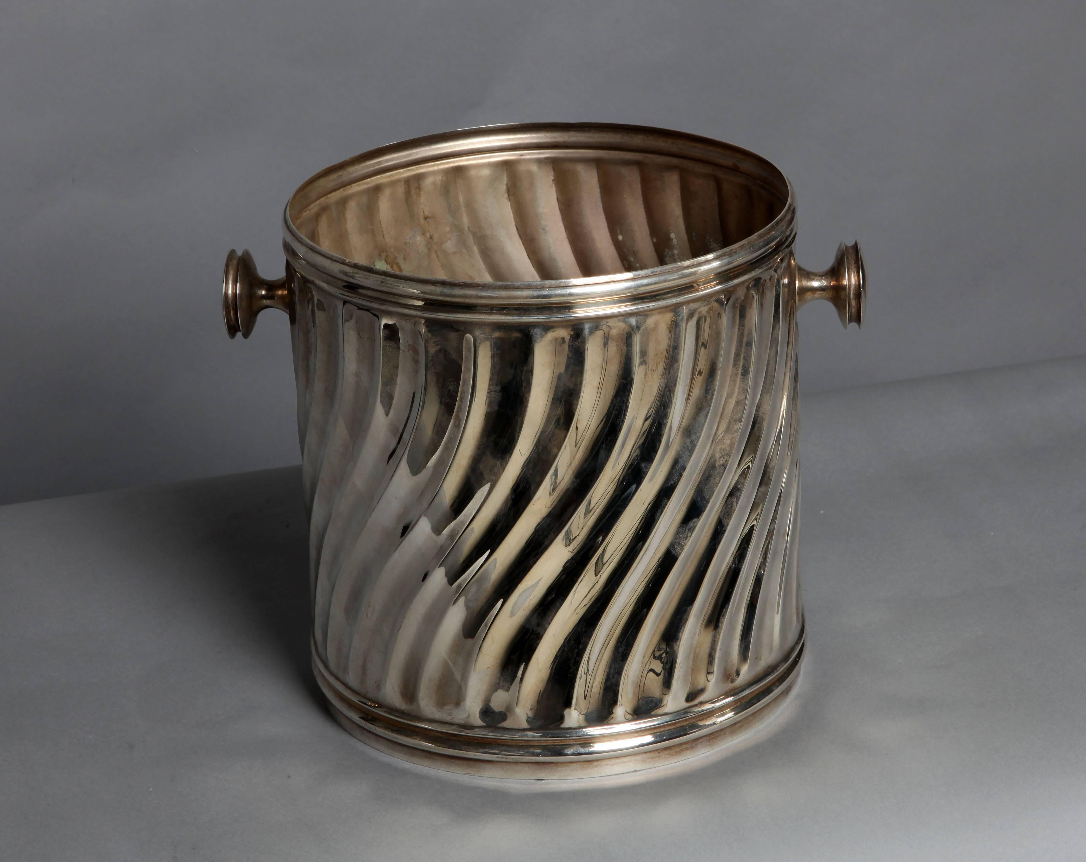 A silver plated Italian bucket with wavy surface.