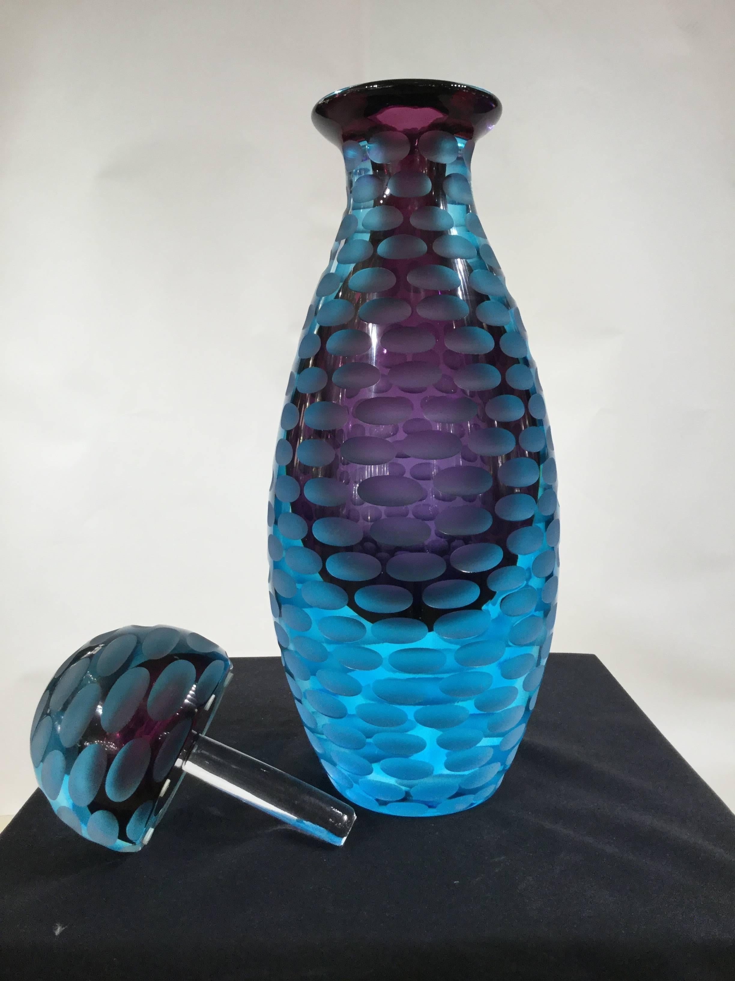 Amazing faceted purple/ and blue Murano glass Sommerso bottle
This hand blown glass bottle is made of purple glass submerged into blue glass. Designed with decorative faceted all around
