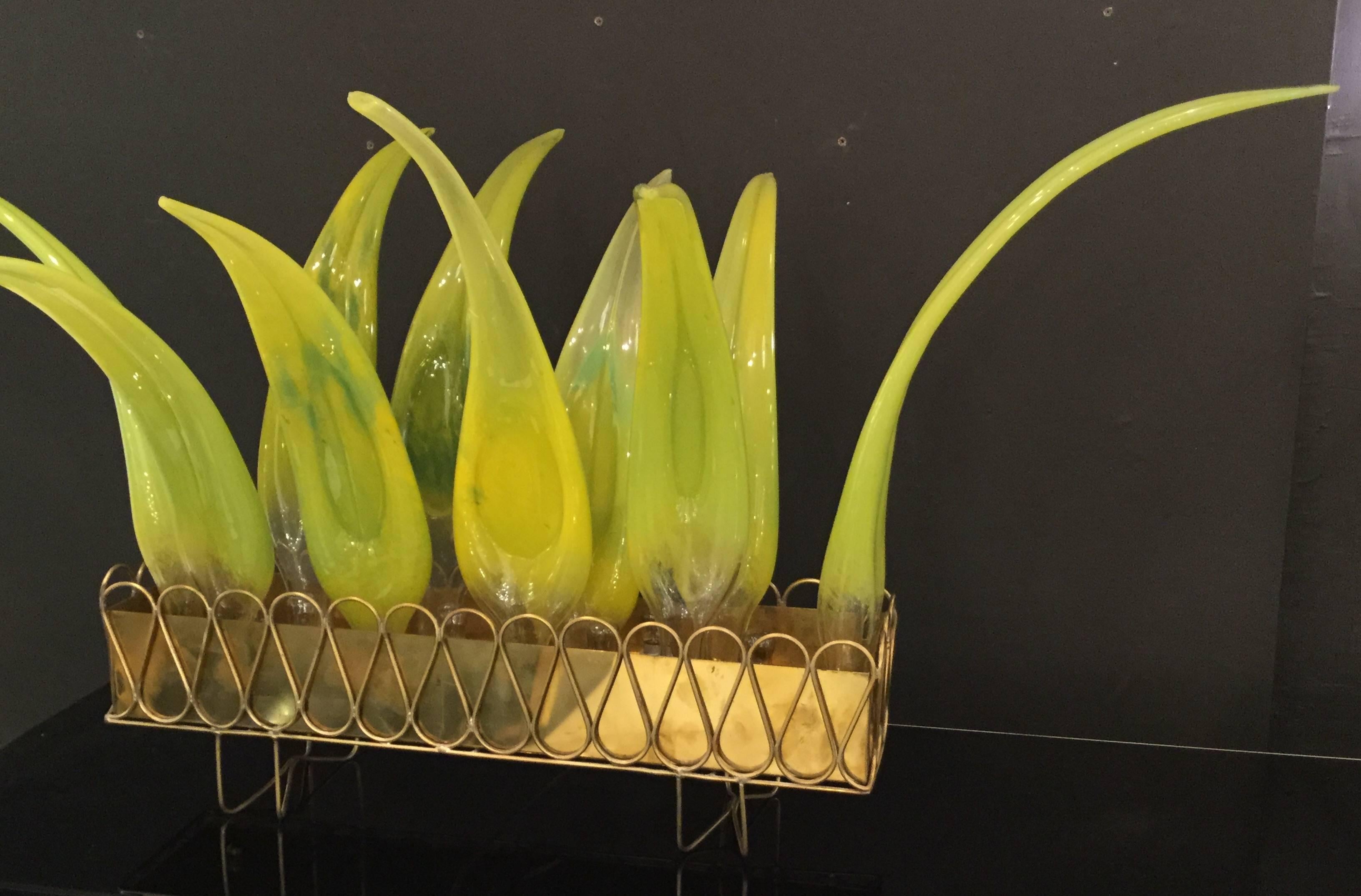 A pair Italian designed foliage table lamps.
Each lamp has ten aloe vera leaves mounted on a brass structure illuminated by eight bulbs.