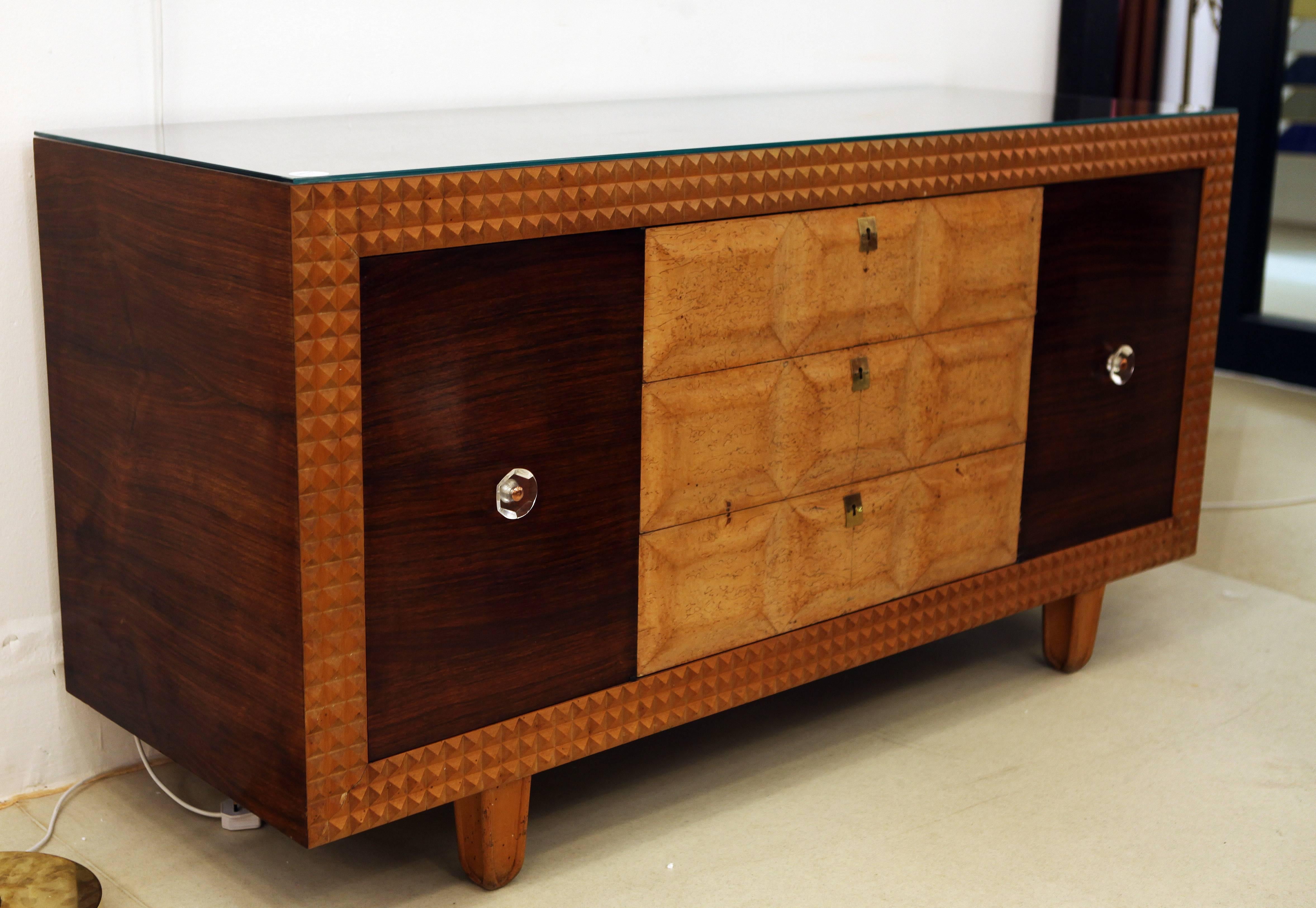 A superb Italian designed credenza or buffet crafted in exotic woods of Rosewood walnut and mahogany. Framed with raised geometric marquetry with similar work on the drawers the use of the three exotic woods creates great contrast beautifully