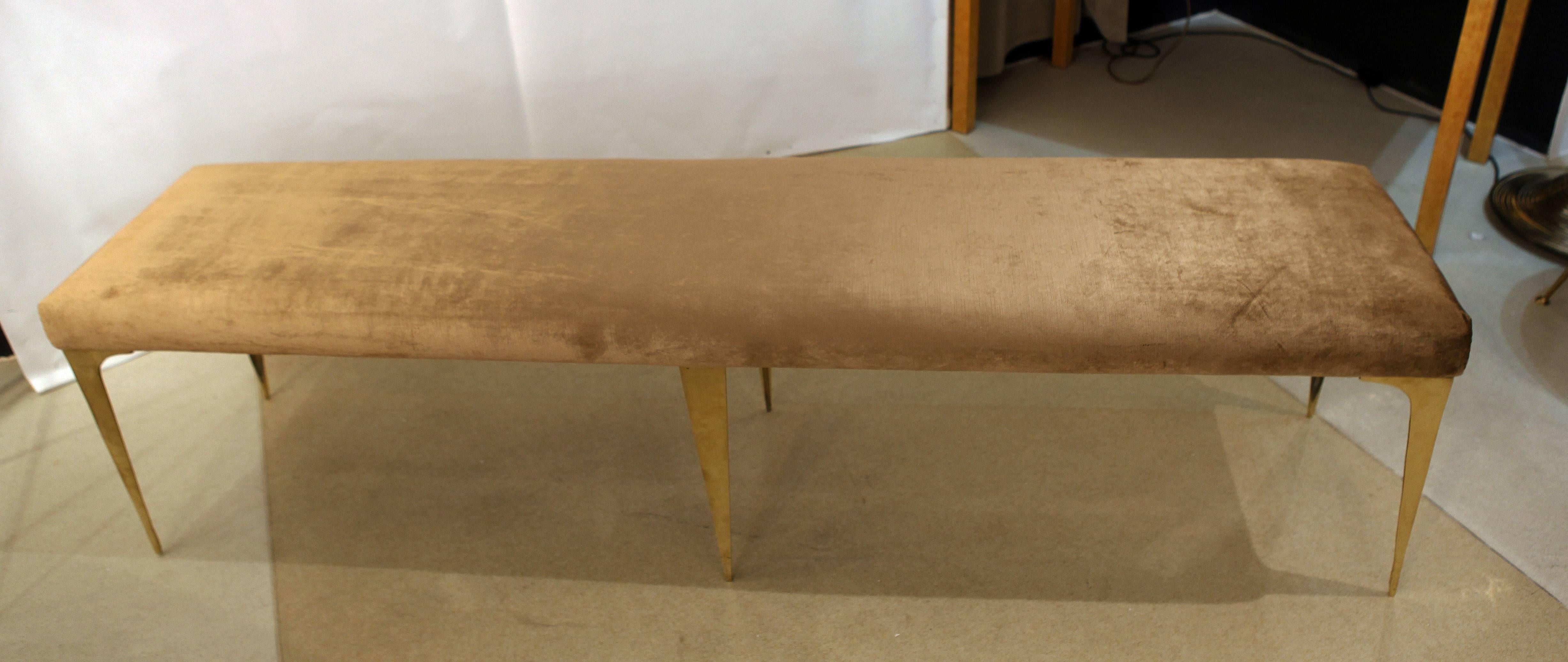 A pair of super glamorous long Italian designed benches reupholstered in gold velvet with stiletto bronze legs Hollywood Regency style Fantastic proportions great with a dining table or in a lobby area.