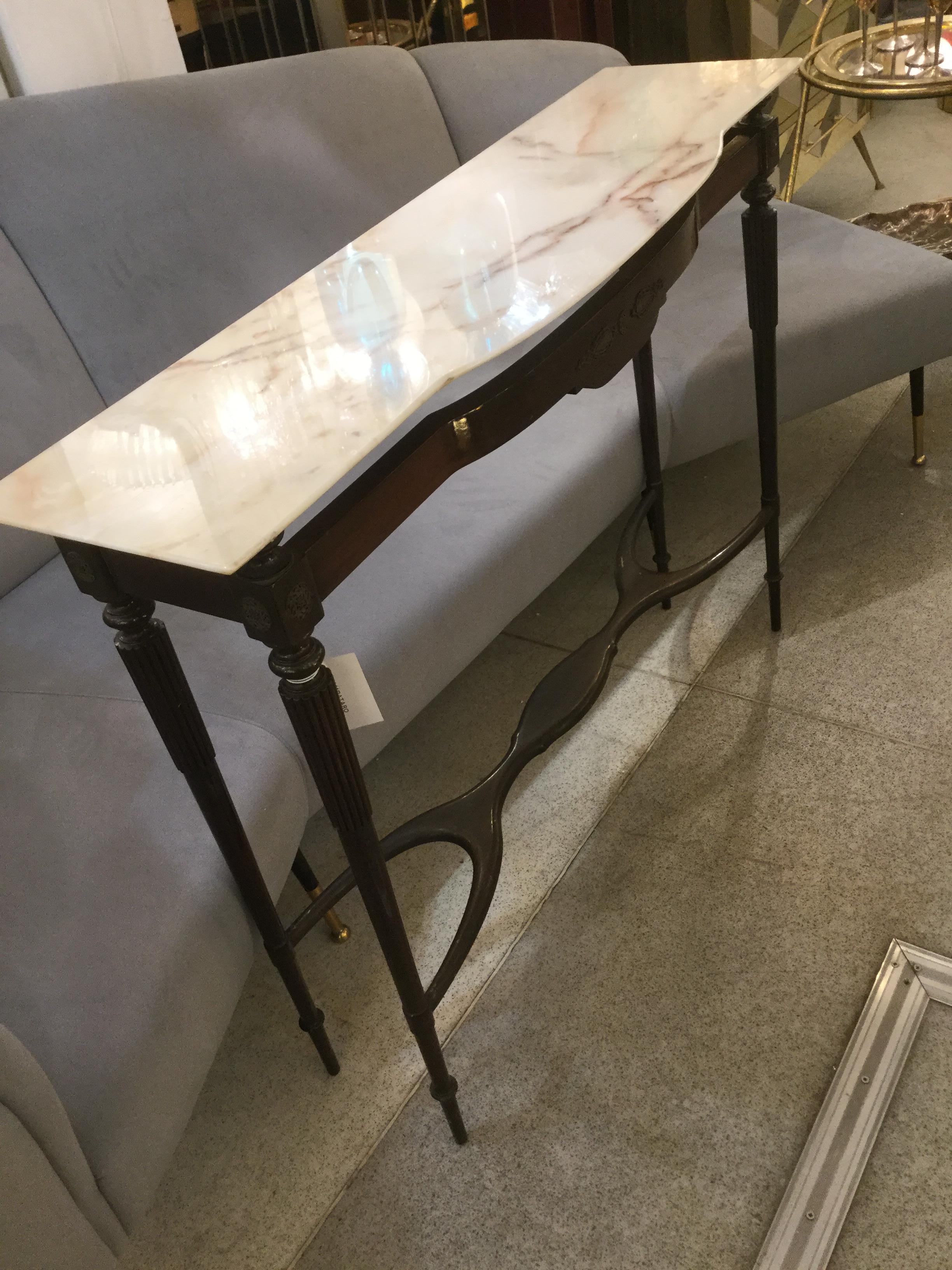An Italian designed console table ebonized wood with Carrara marble top attributed to Guglielmo Ulrich, 1940.