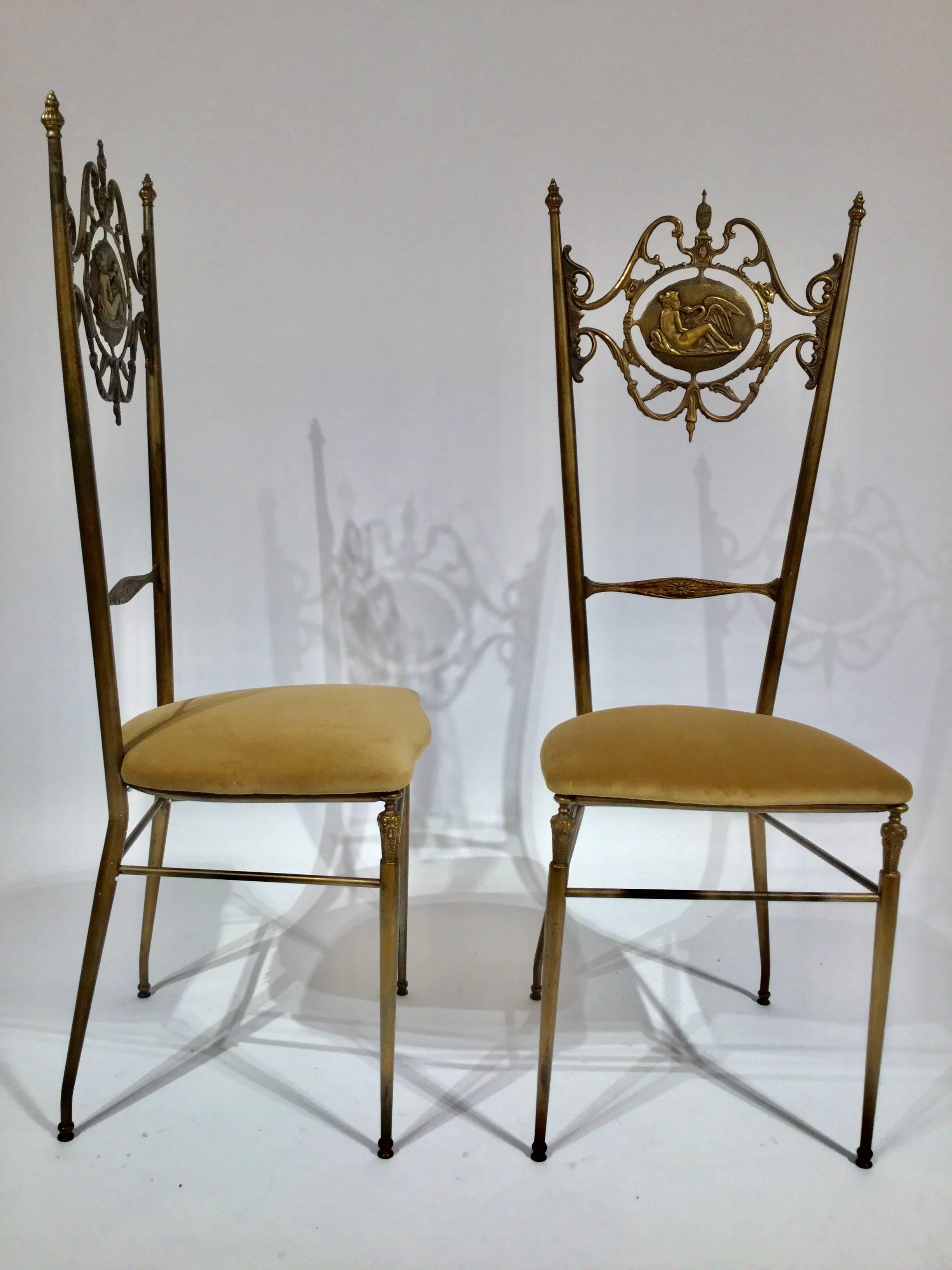 A pair of Italian designed Chiavari neoclassical chairs. Brass velvet seat on the chair back a centre median depicting the Greek mythology Leda and the Swan, circa 1950.
Would work well as side chairs, great in a dressing powder room or fantastic