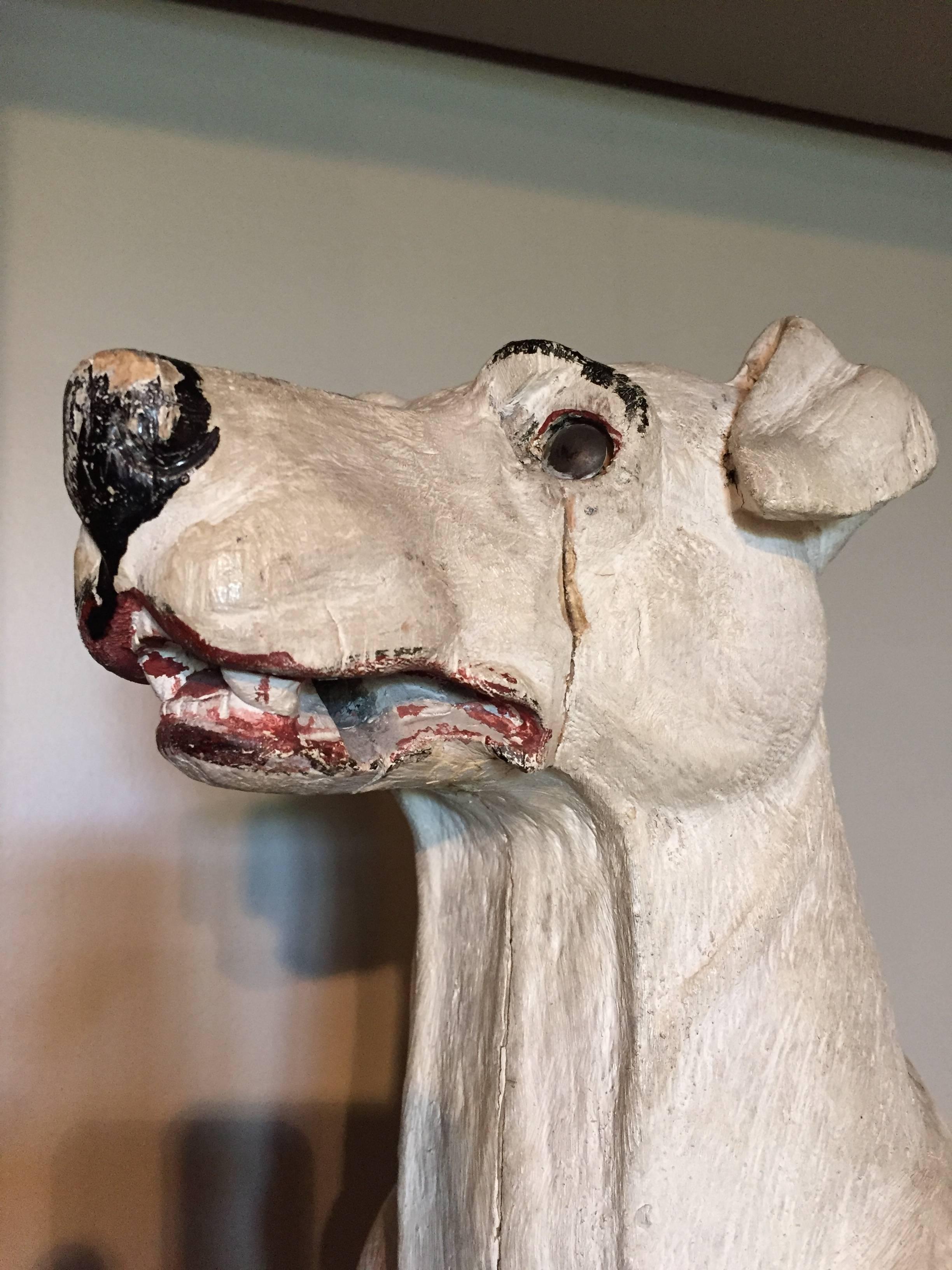 A late 19th-early 20th century carved and painted wooden model of a Jack Russel, England.