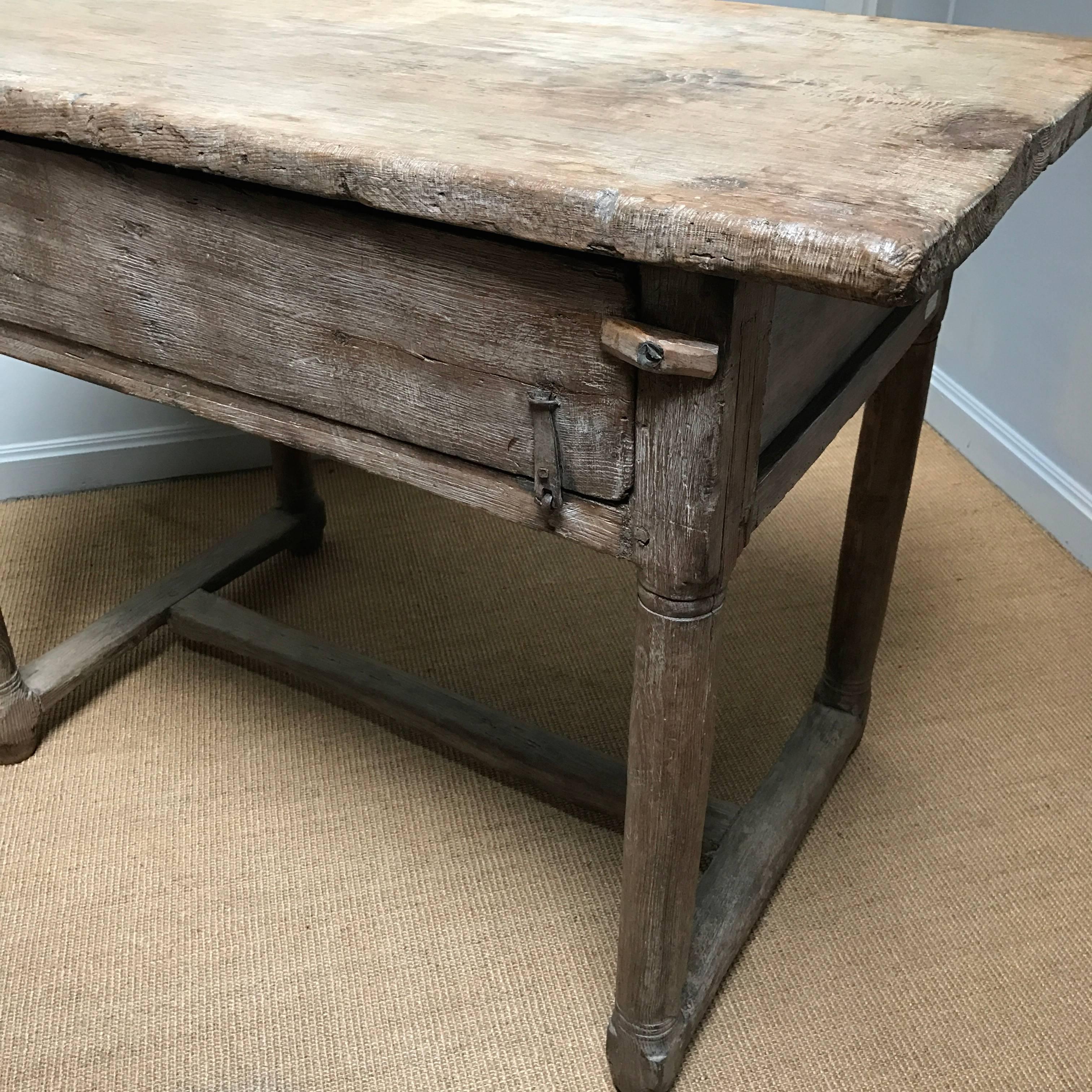 Exceptional French 18th century bleached farm table in Chestnut wood with one drawer and Masonic marks as a protection against bad spirits....
from the Southern part of France.