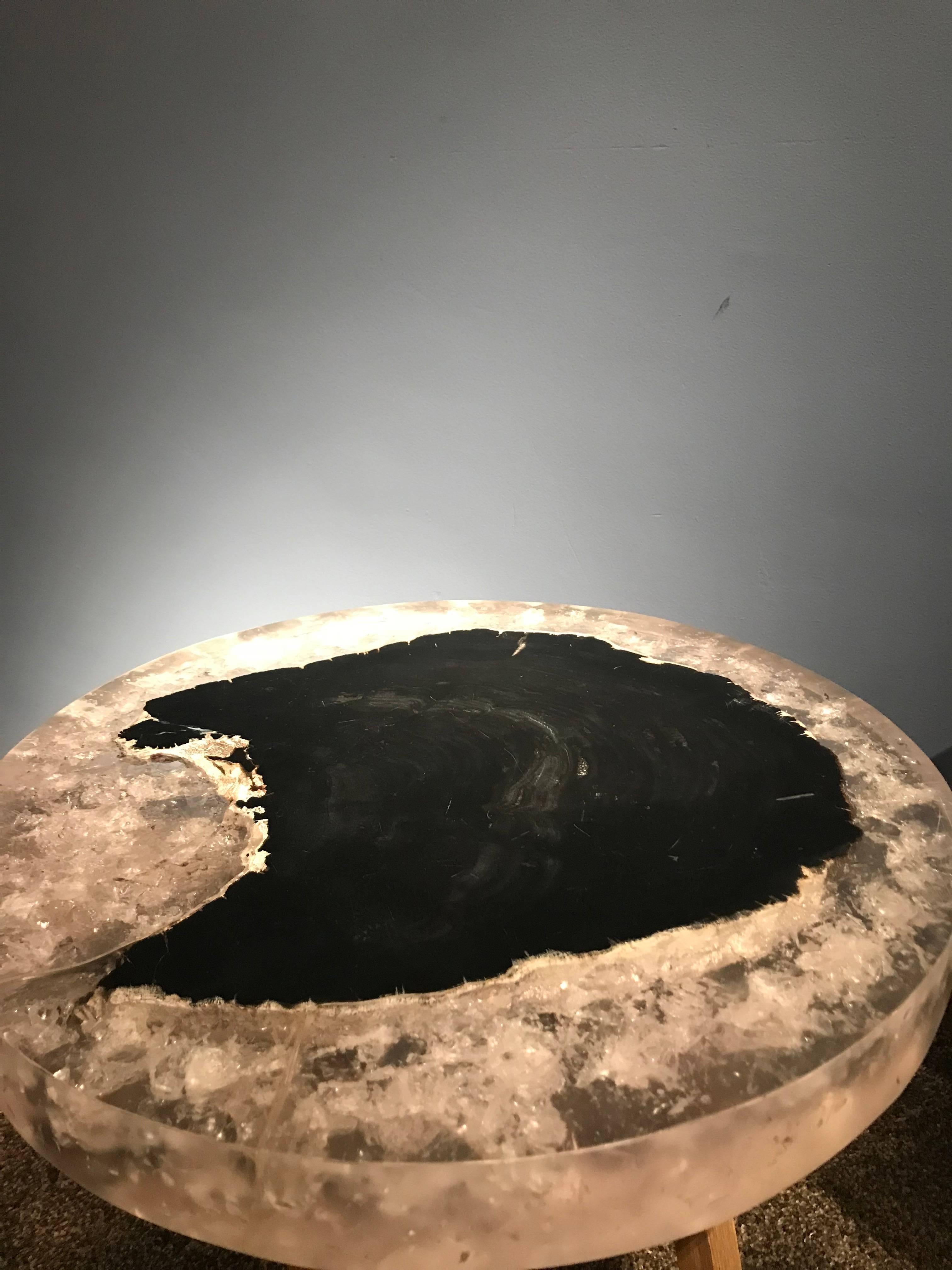 Pair of round tables on wooden stand
petrified wood with resin 