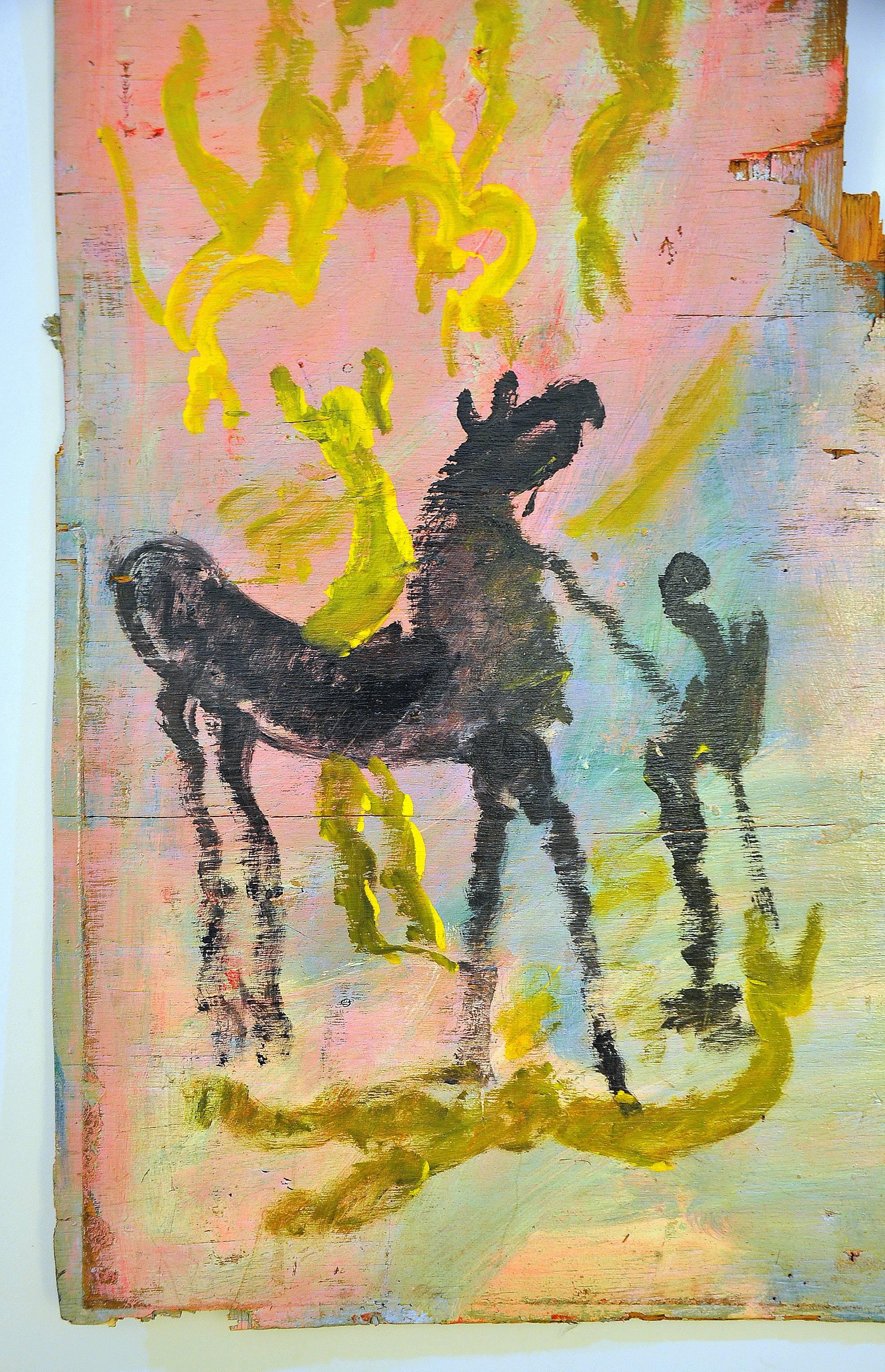 A captivating work featuring oil painting on found board, with graffiti covered backside, by self-taught artist Purvis Young (February 4, 1943 – April 20, 2010). The work depicts a scene of an individual next to a horse and the artist's instantly