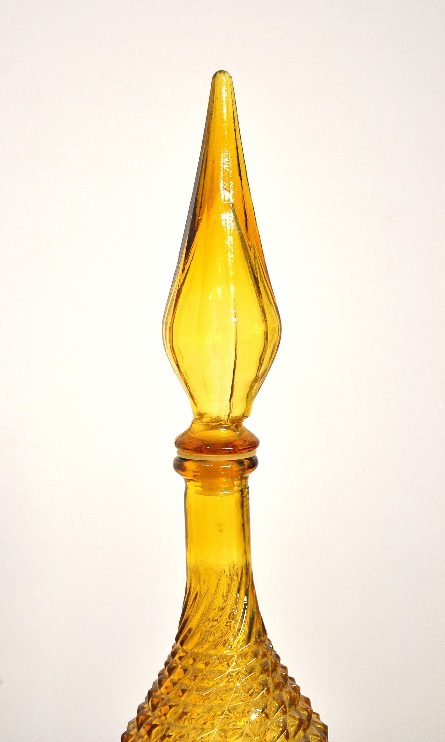 This vintage Italian Mid-Century Modern large handblown glass decanter features a diamond pattern and a rich, amber or honey yellow color. Manufactured by Rossini, it dates from the 1960s. Quite tall and very decorative! Base diameter is 3