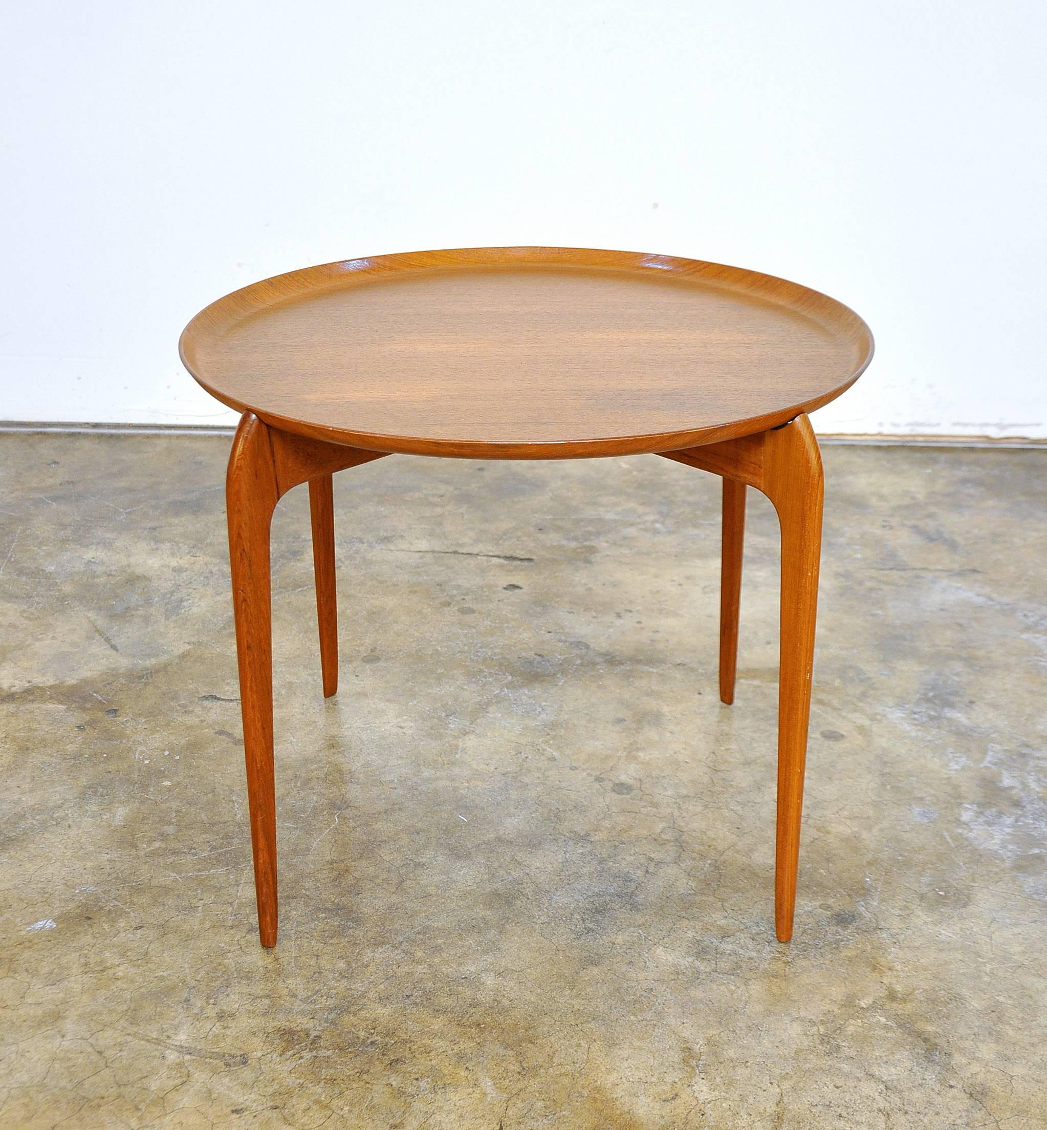A pretty Danish Modern vintage teak end or occasional table featuring a removable tray top, in the manner of H. Engholm and Svend Aage Willumsen, dating from the 1960s. Made in Denmark. Please contact Select Modern for additional photos.