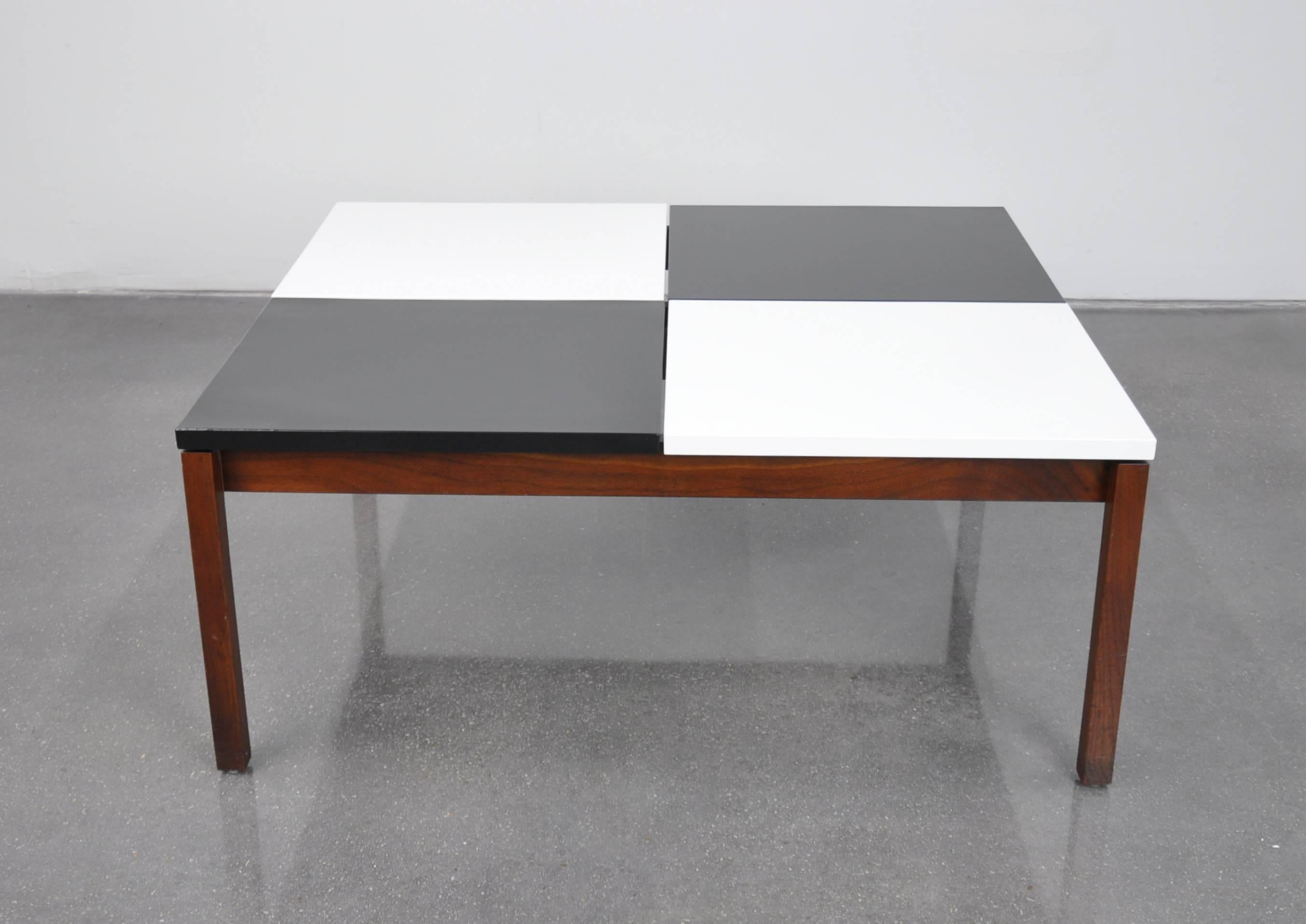 An early example of the Mid-Century Modern Model 350 cocktail table designed by Lewis Butler for Knoll in 1953. The vintage table features a black and white checkered top floating over a walnut frame. Like many of Florence Knoll’s early pieces, the