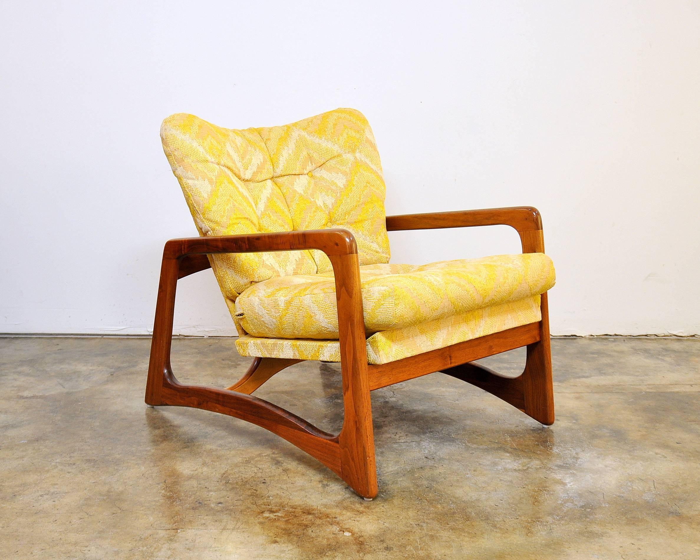 Mid-Century Modern armchair featuring a gorgeously grained sculpted walnut biomorphic frame, a quintessential characteristic of legendary, hall of fame designer Adrian Pearsall. The frame is in pristine, refinished condition. The chair retains its
