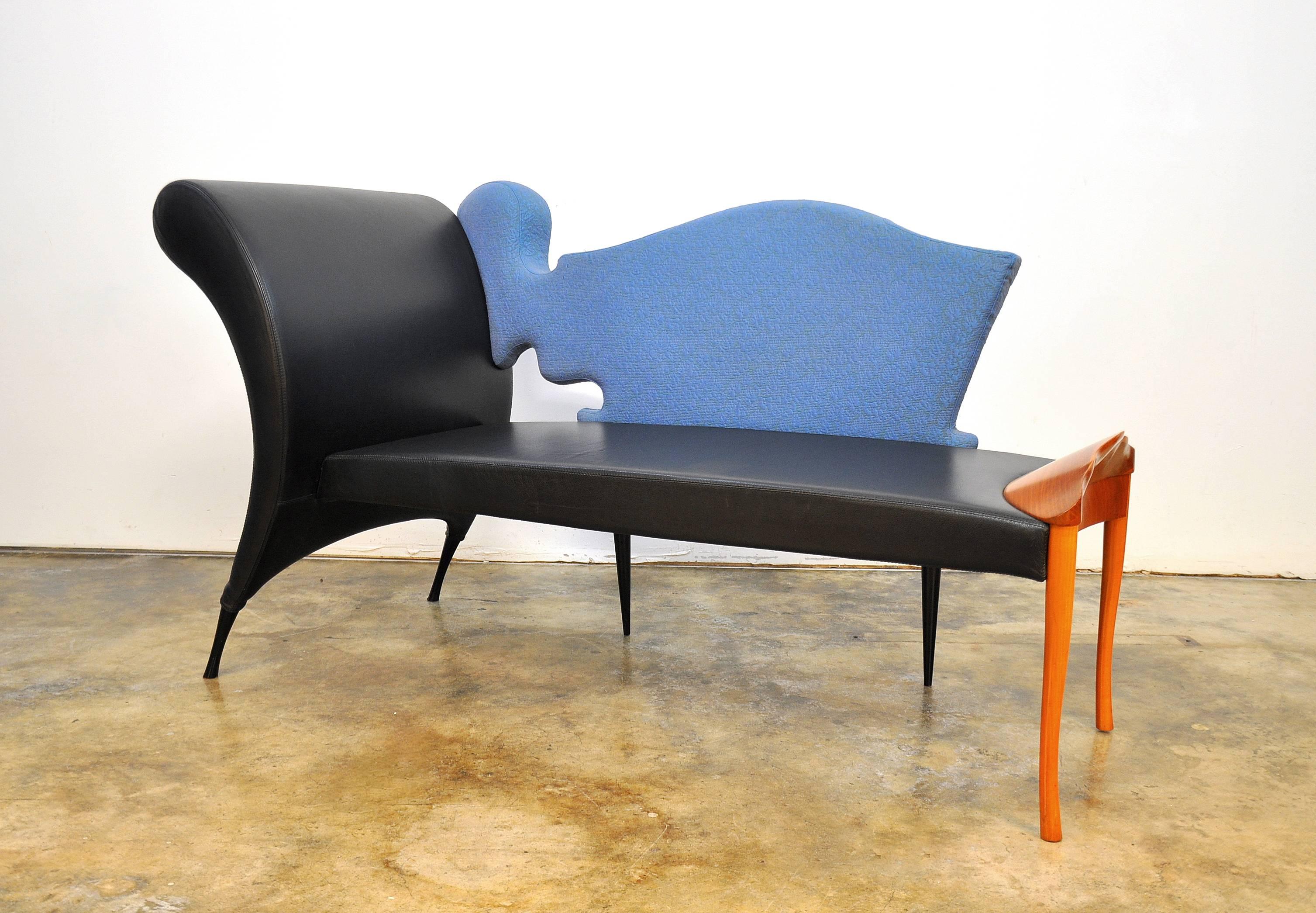 The Czech architect, designer and artist Borek Sipek's Postmodernist lounge, with its striking curves in black leather and rich upholstery, juxtaposed with sculpted cherrywood, exemplifies the unique style he is renowned for. In this creation from