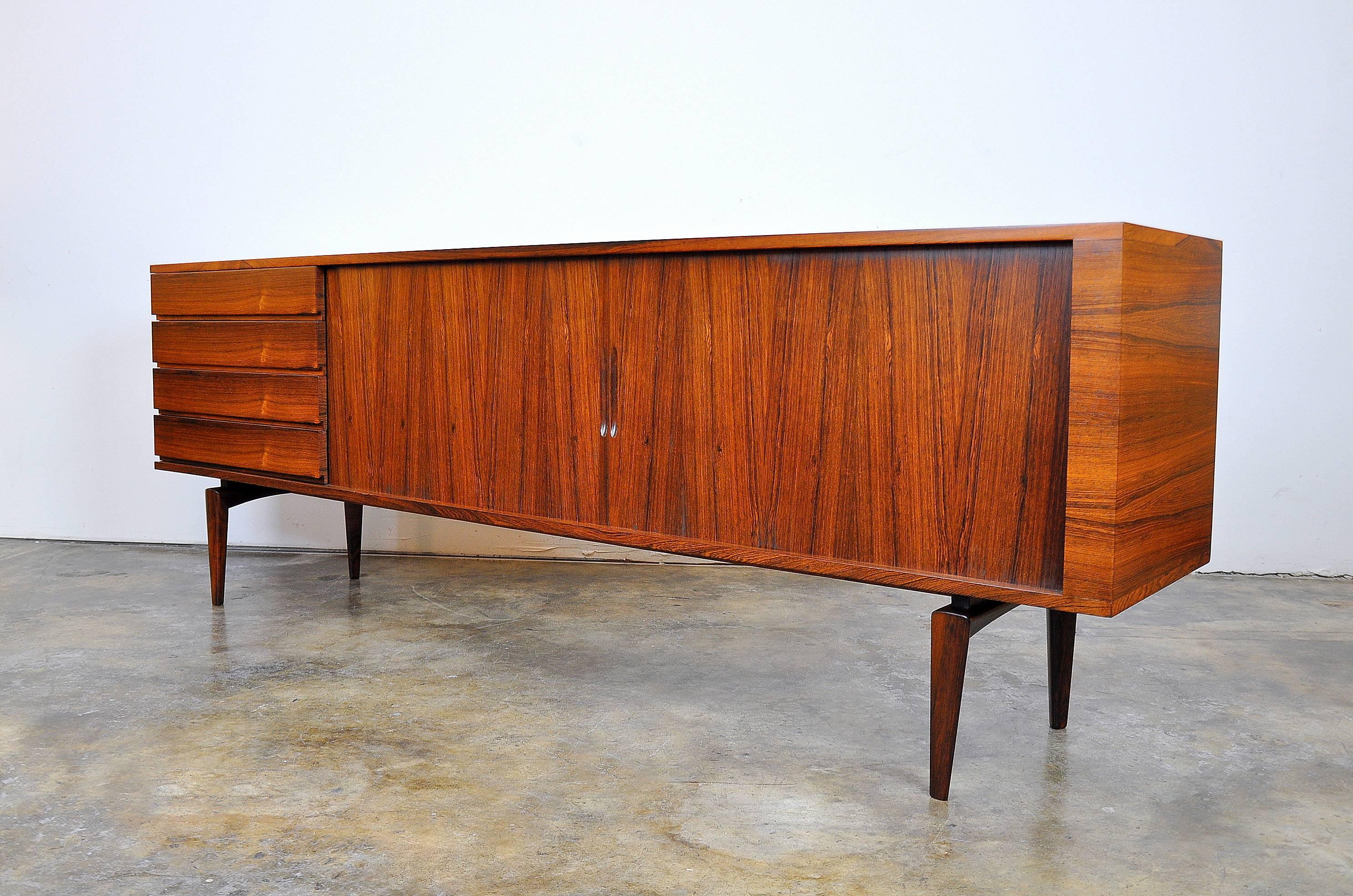 Outstanding Mid-Century Danish Modern sideboard designed by Scandinavian legend Henry Walter Klein for Bramin Mobler NA Jorgensens Mobelfabrik in the 1960s. This stunning buffet features a striking Silhouette very similar to the Presidential