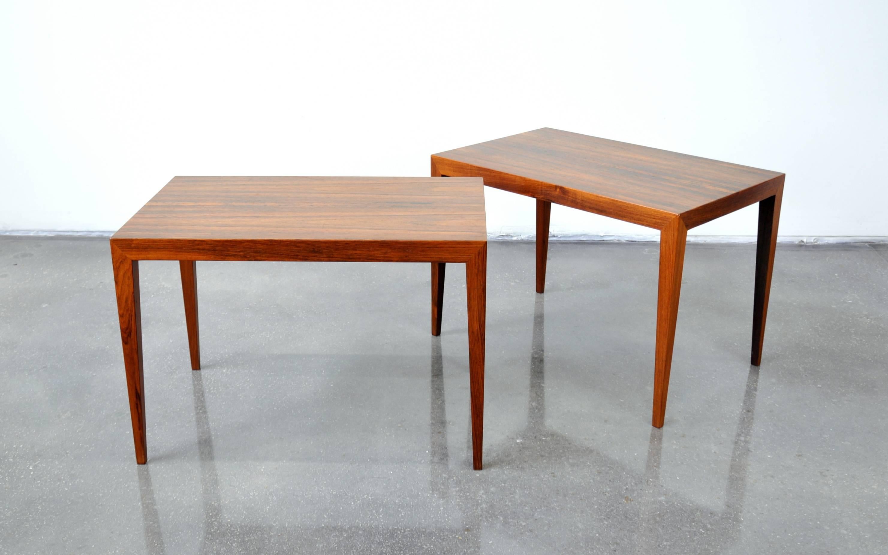 Gorgeous pair of Mid-Century Brazilian rosewood end tables designed by Severin Hansen for Haslev Mobelsnedkeri, dating from the mid-1950s. The occasional tables feature perfectly bookmatched rosewood grains that cleverly allow them to be used