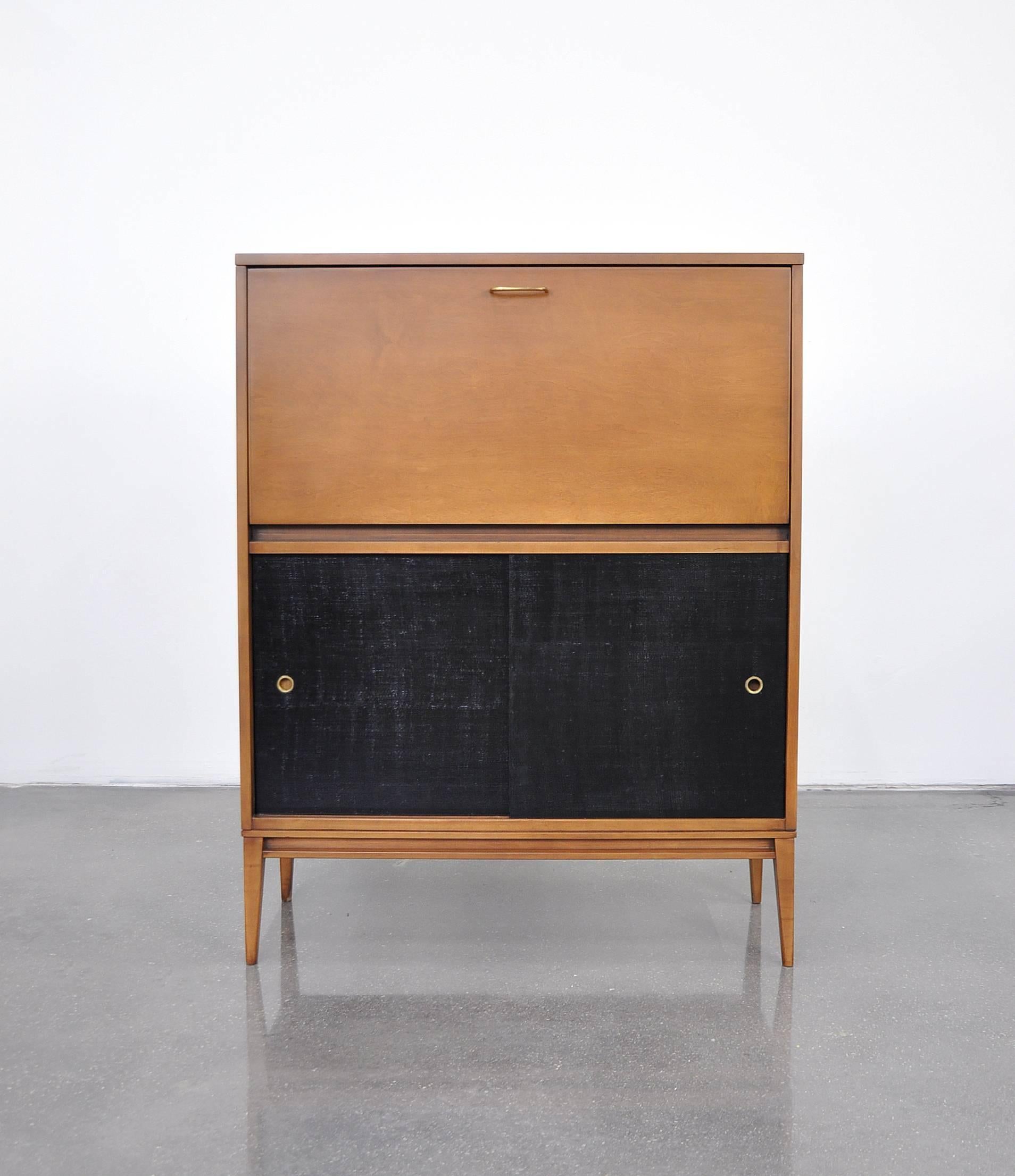 A very nice example of a Mid-Century Modern fall-front secretary designed by Paul McCobb for the Planner Group line, manufactured by Winchendon Furniture in the 1950s. A versatile piece that could be also used as a bar cabinet. Fitted with the