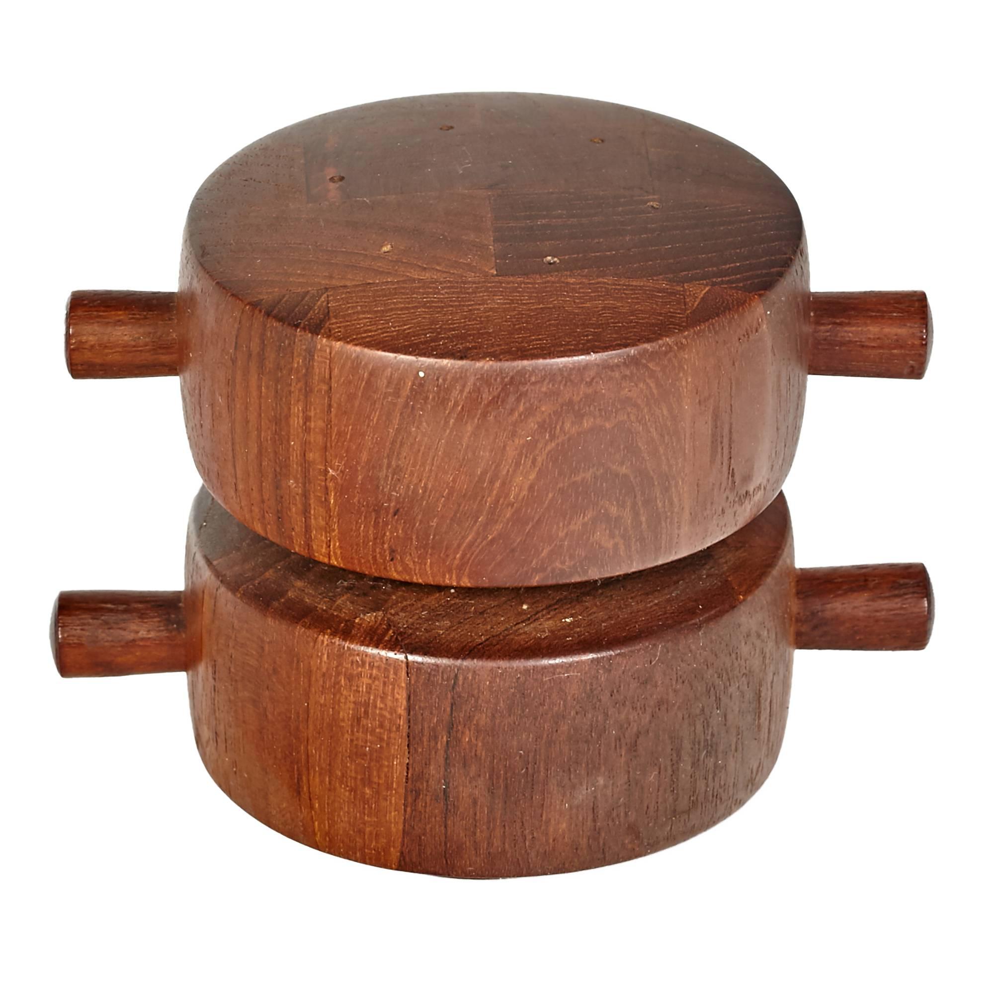 Mid-Century Dansk teak two-part salt and pepper mill designed by Jens Quistgaard, Denmark. The mill is re-filled by pulling out the wood pegs. Marked underneath.