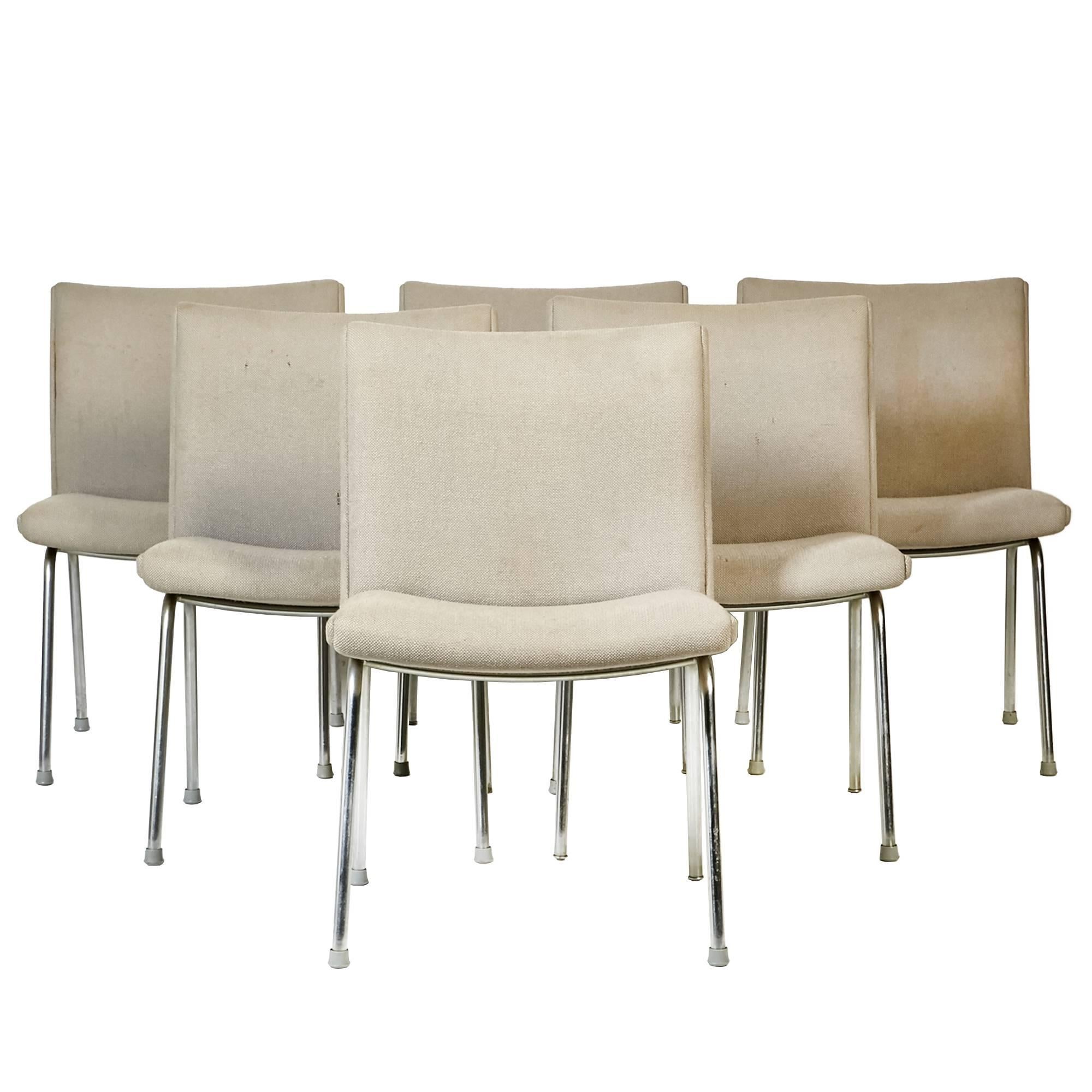 1960s set of six Airport chairs by Hans J. Wegner for Carl Hansen, Denmark. The chairs have the original tweed fabric that needs replacement. Chair frames are sturdy and chrome is in excellent condition with minor wear.