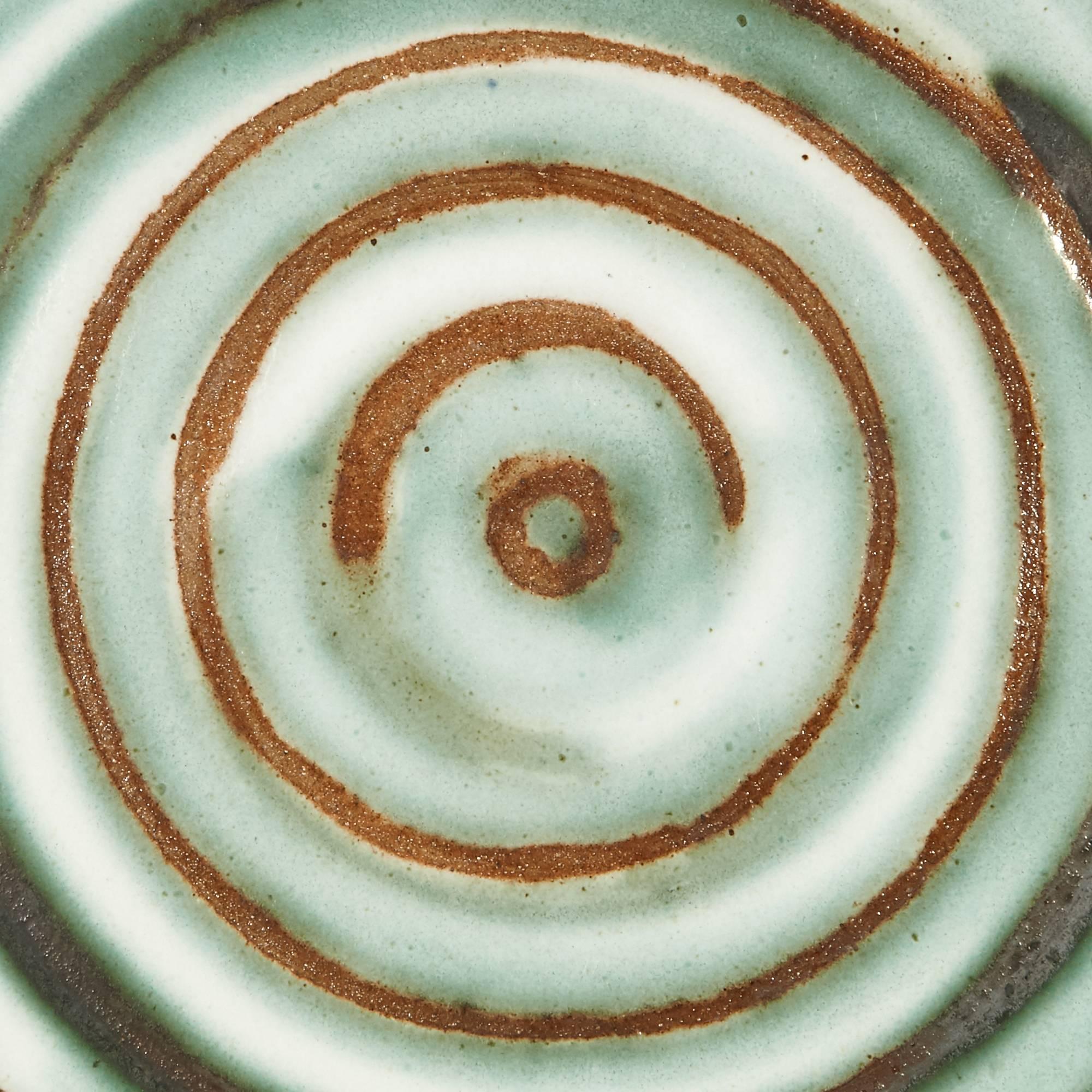 1960s ceramic serving plate in a swirl pattern designed by Gordon and Jane Martz for Marshall Studios. Marked.