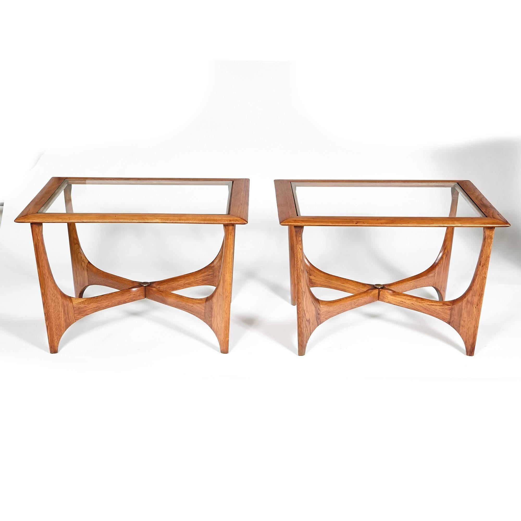 Pair of 1960s rectangular sculpted walnut and glass top side tables by Lane Furniture Co. Marked. Refinished condition.