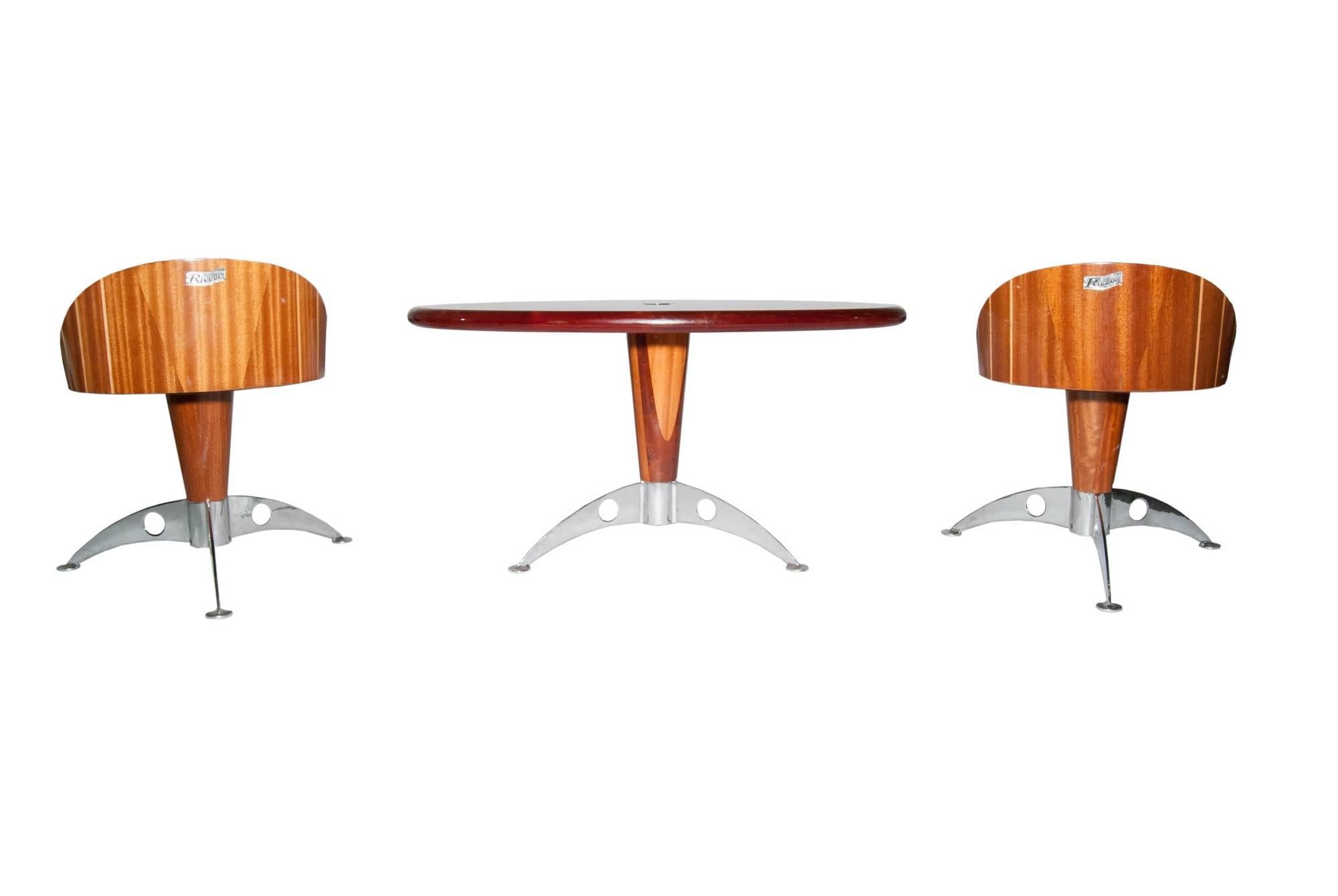 Handcrafted nautical table and two chairs designed by Triconfort for the Rivage collection. The table and chairs are highly lacquered with an inlaid design; the chairs have hand-stitched white leather seats, all on cast aluminum bases. Measures: The