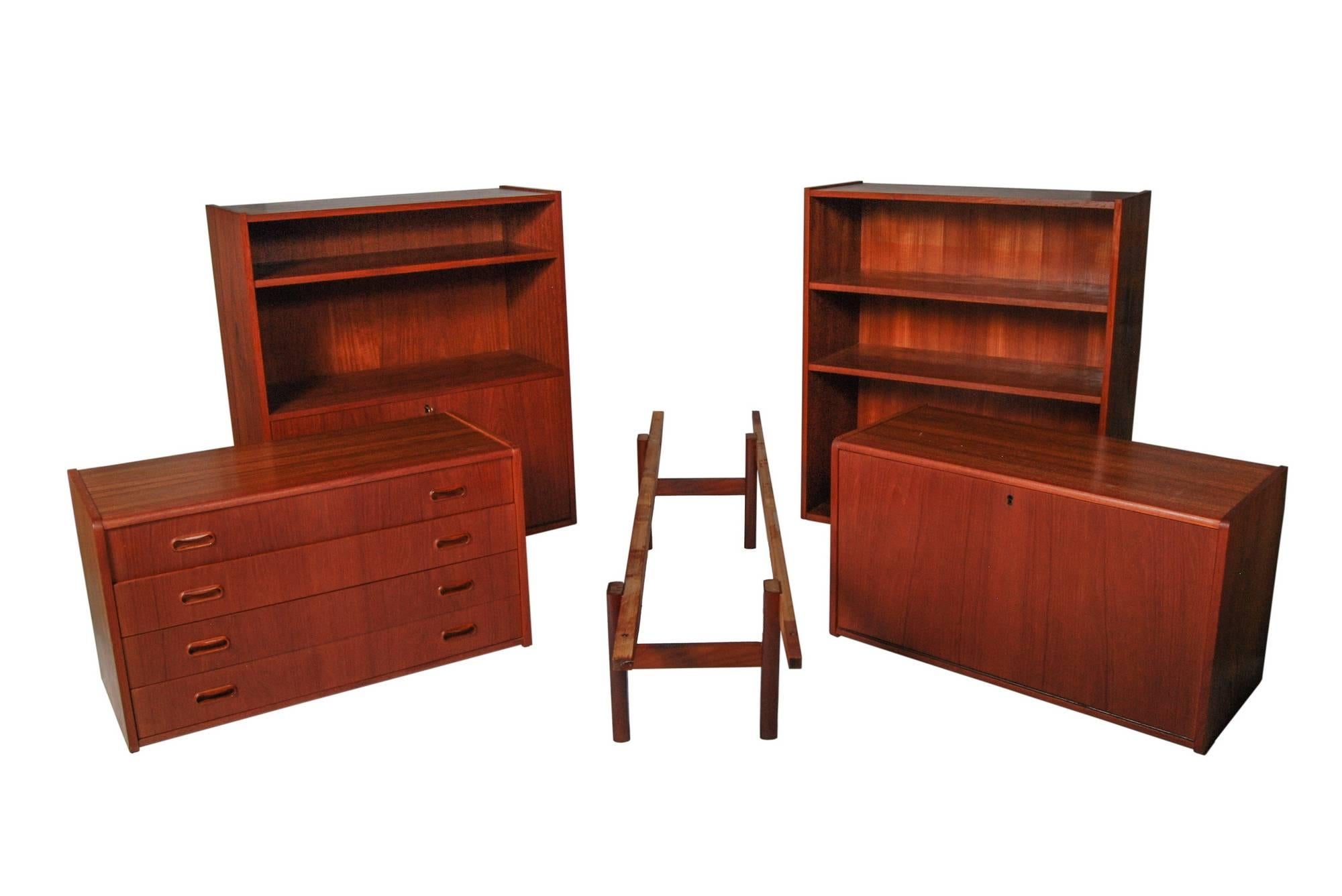 Vintage 1960s teak five section modular storage unit designed by Børge Mogensen, Denmark. The unit can be used in multiple different ways and has adjustable shelving, drawers with sculpted handles and a pull down desk or writing area. Unmarked.