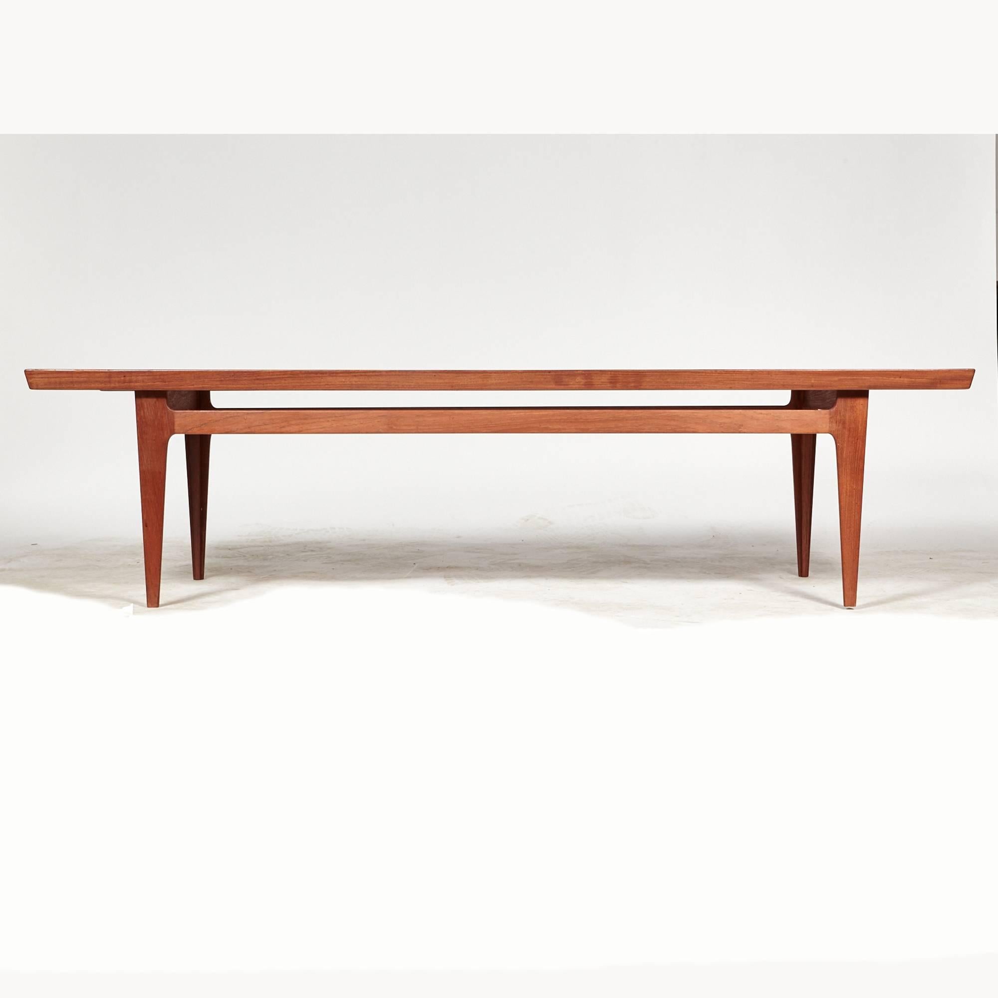 Danish solid teak coffee table designed by Finn Juhl for France & Sons in the 1950s. The table has raised sides and marked underneath.