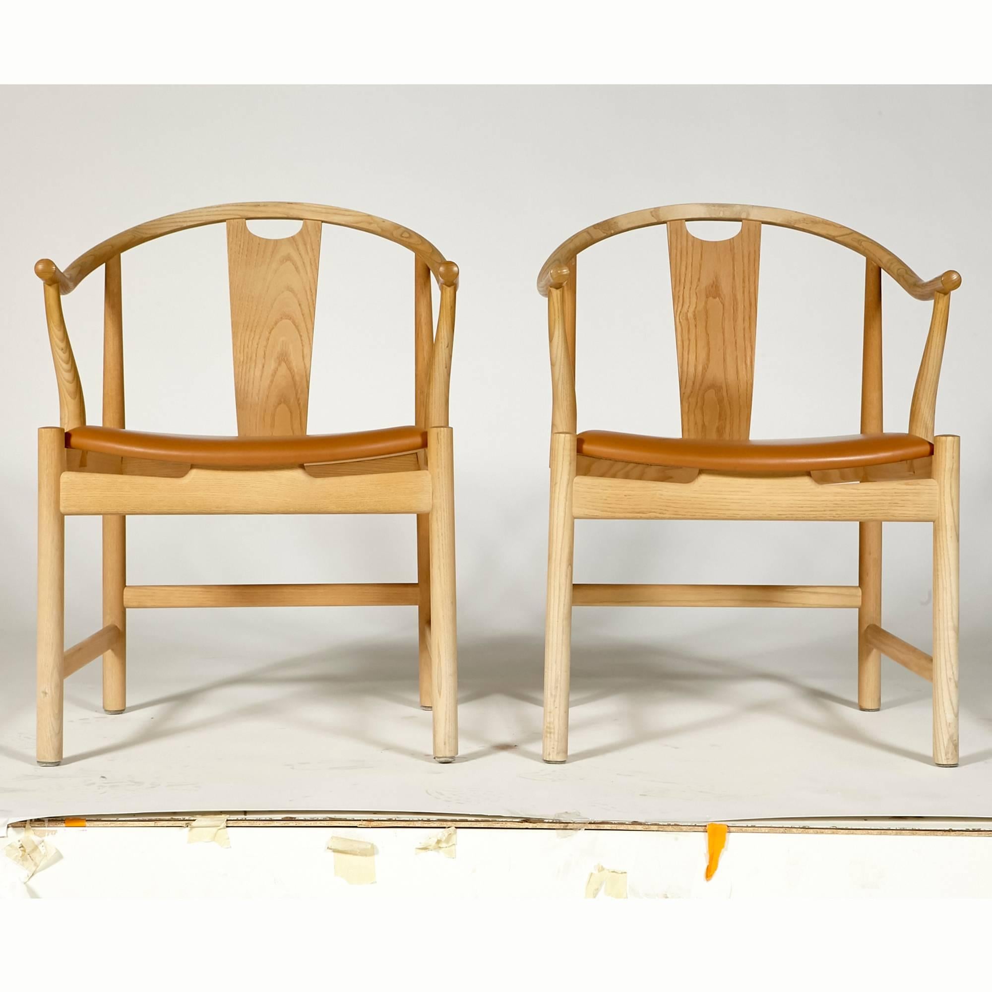 Pair of China chairs designed by Hans J. Wegner for PP Mobler in ashwood. The chairs have new cognac leather upholstery. Excellent condition. Marked.



 