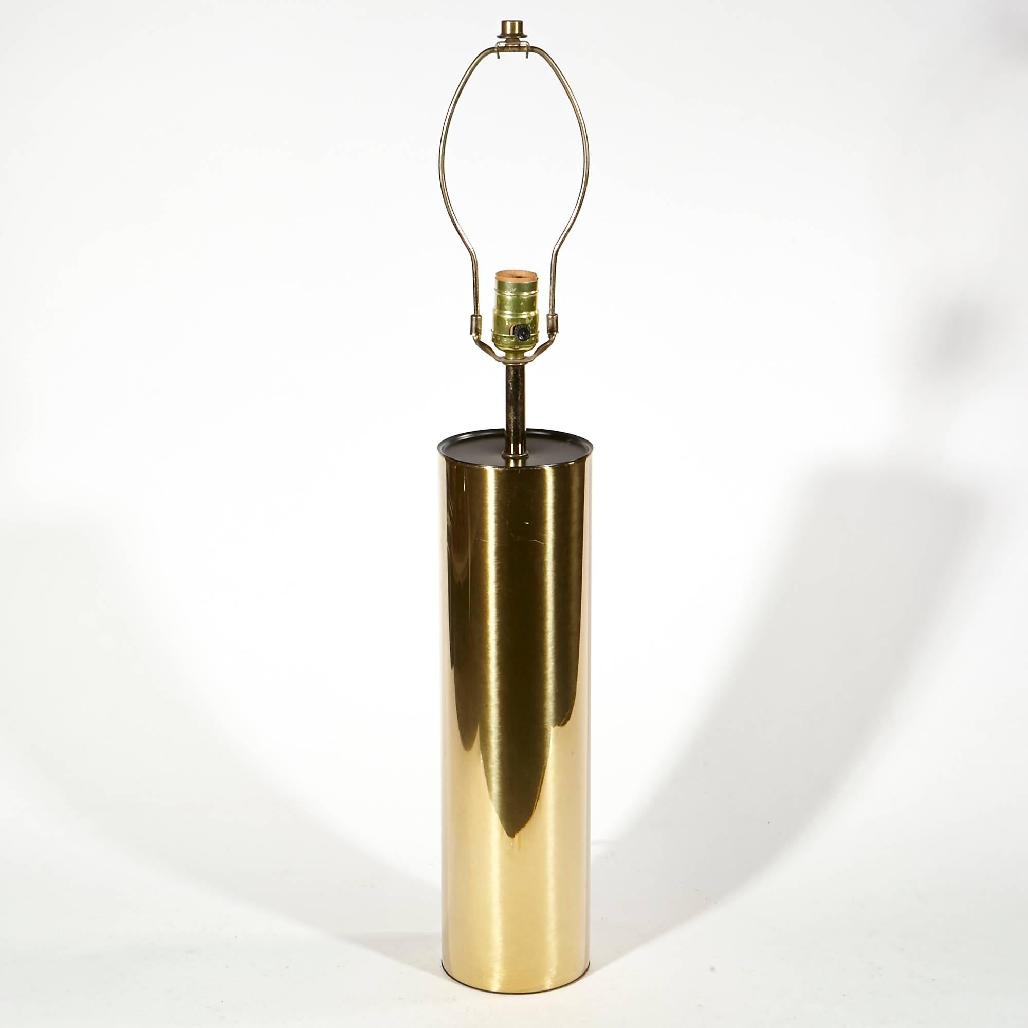 Vintage 1970s brass cylindrical table lamp designed by George Kovacs. Uses standard bulb size. Shade is not included. Socket: 21in.H. Harp: 4.25in.D x 9in.H.