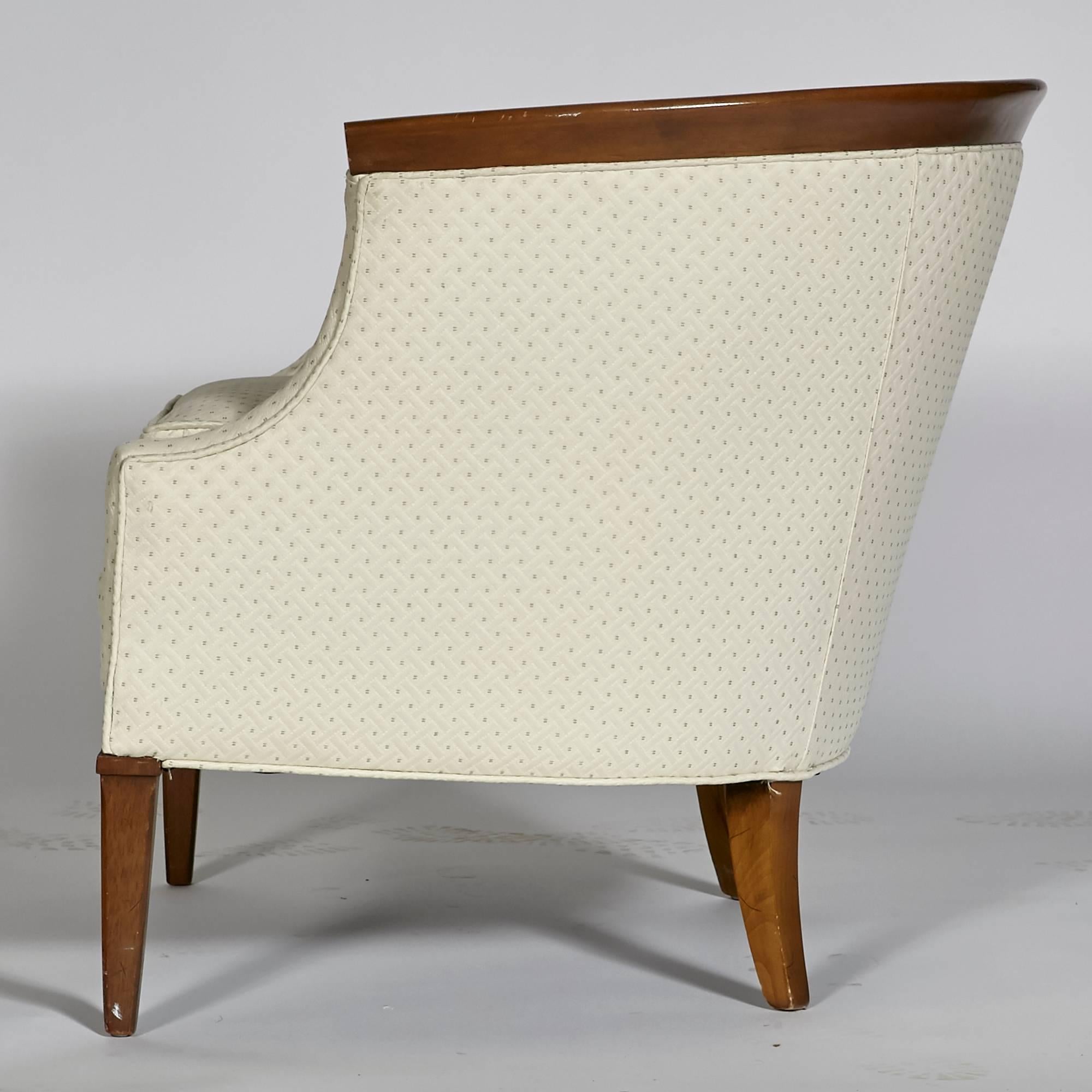 Vintage 1960s walnut sculpted lounge chair with a tufted and curved back designed by Erwin-Lambeth. Chair fabric is not original but recommend fabric be replaced. Cushion foam and structure is sturdy. Light wear to legs from use. Unmarked.
