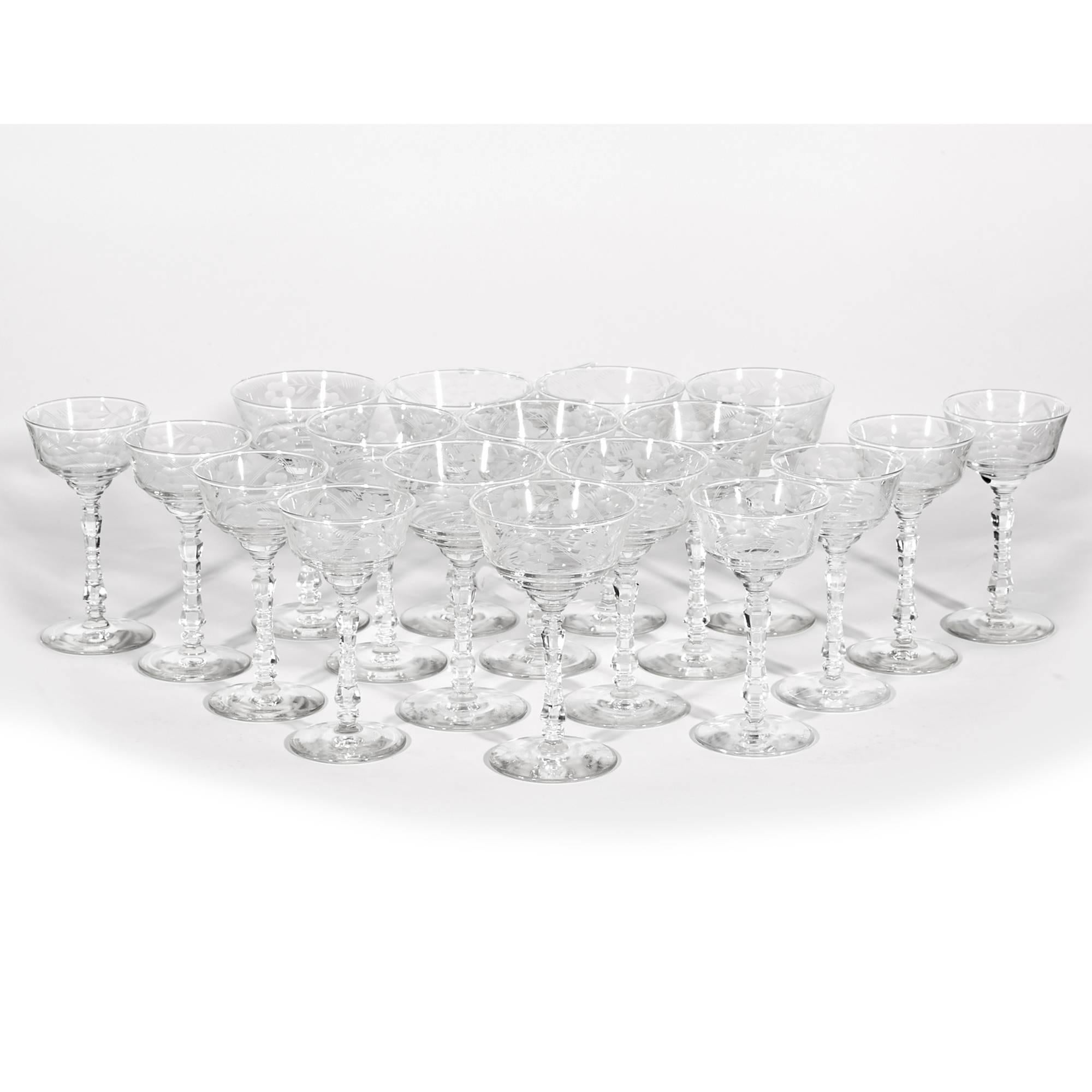 Vintage 1960s, set of 18 floral etched rock crystal coupe stems in two different sizes by Libbey Glass Co. Eight small wine coupes measures 3