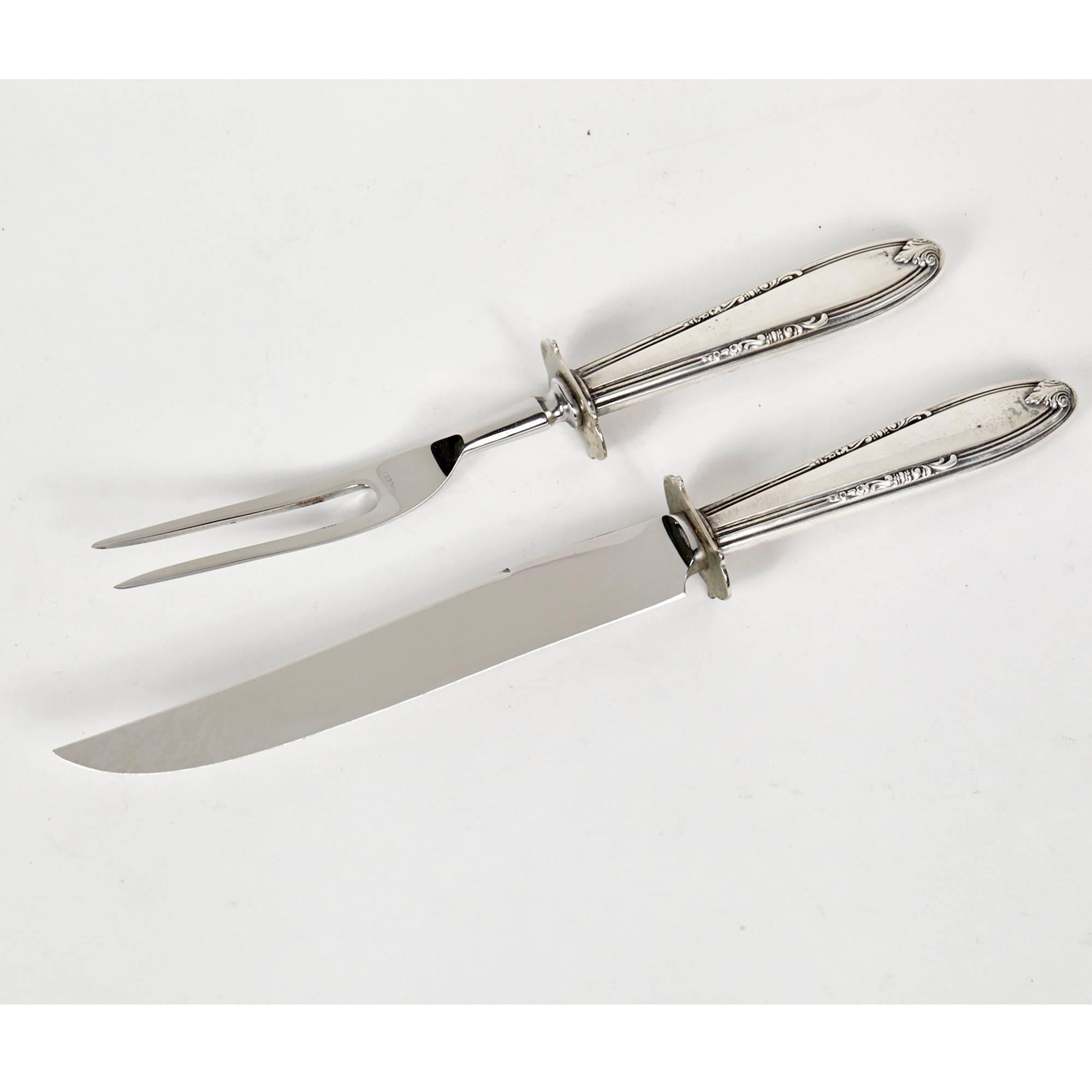 Pair of sterling silver handled carving fork and knife set, circa 1950s. Measures: Fork 8.75