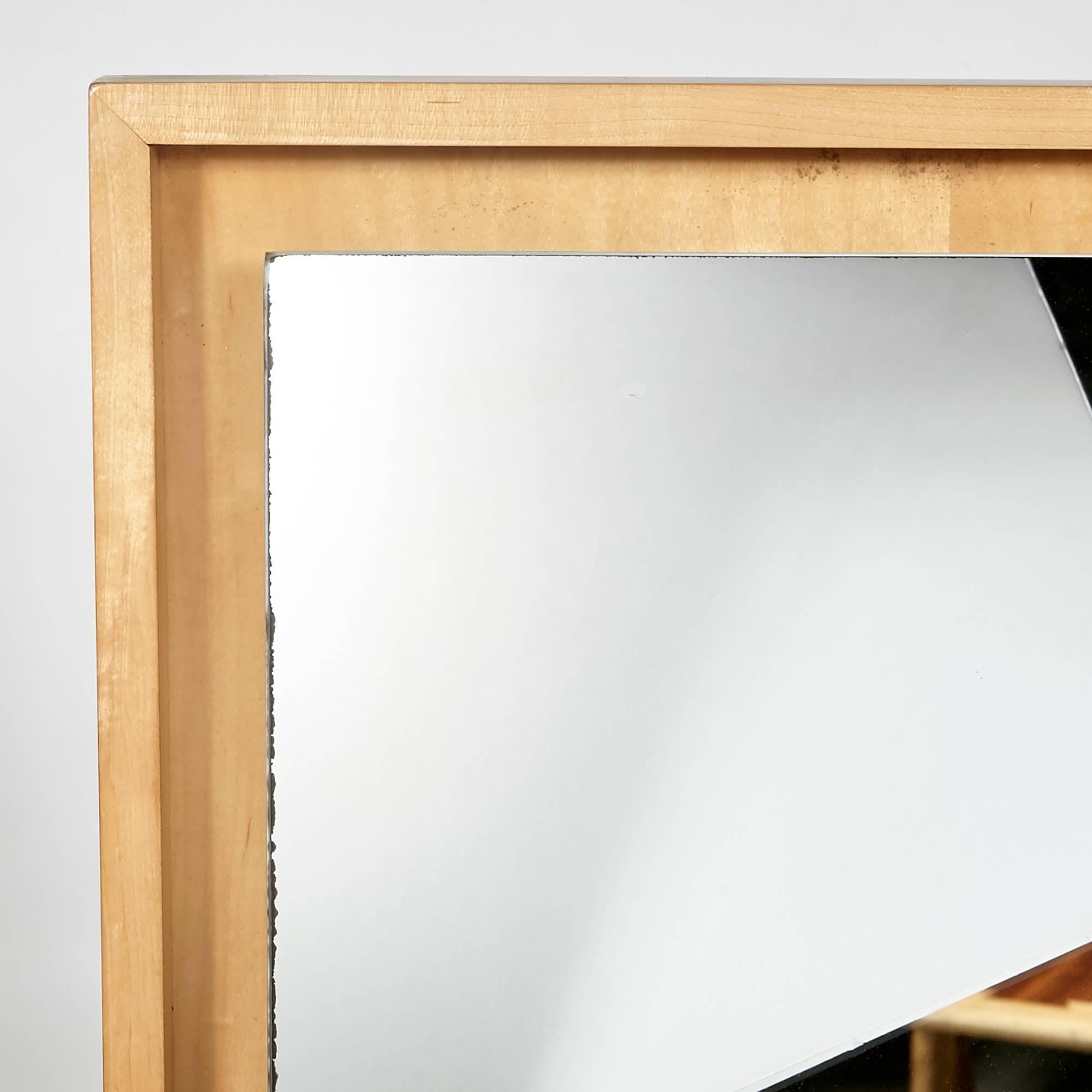 Vintage mid-20th century modern inset maple wood wall mirror with the design attributed to Conant Ball, circa 1960s.