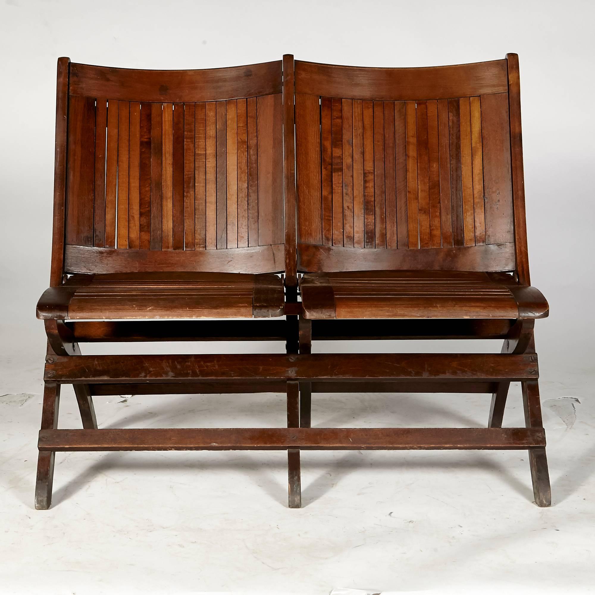 Heywood-Wakefield style folding wood stadium seat for two, circa 1930s. The seat is in refinished condition. Unmarked.