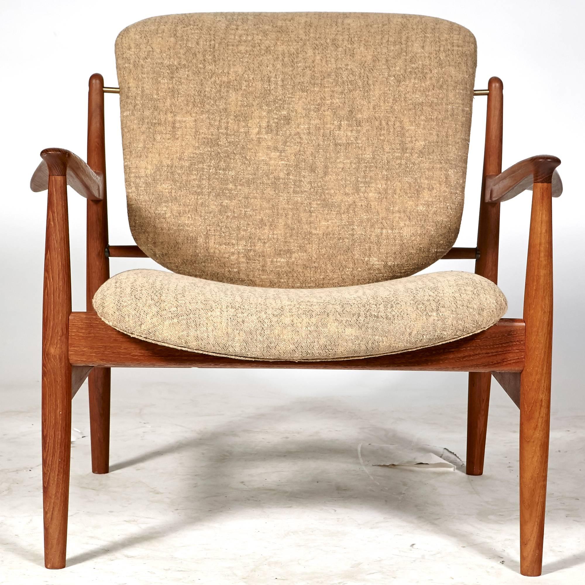 Vintage Finn Juhl FD-136 Danish lounge chair in teak, circa 1950s. Original fabric. Marked. Seat height 16in. Measure: Arm height 21in.