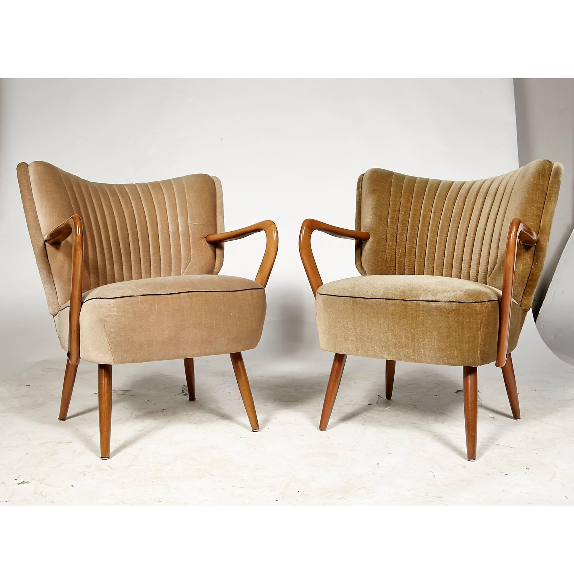 Vintage mid-20th century Swedish lounge chairs with channeled backs, circa 1950s. The fabric is in original condition. The chairs have curved arms and tapered legs. Arm height is 23in. 



 