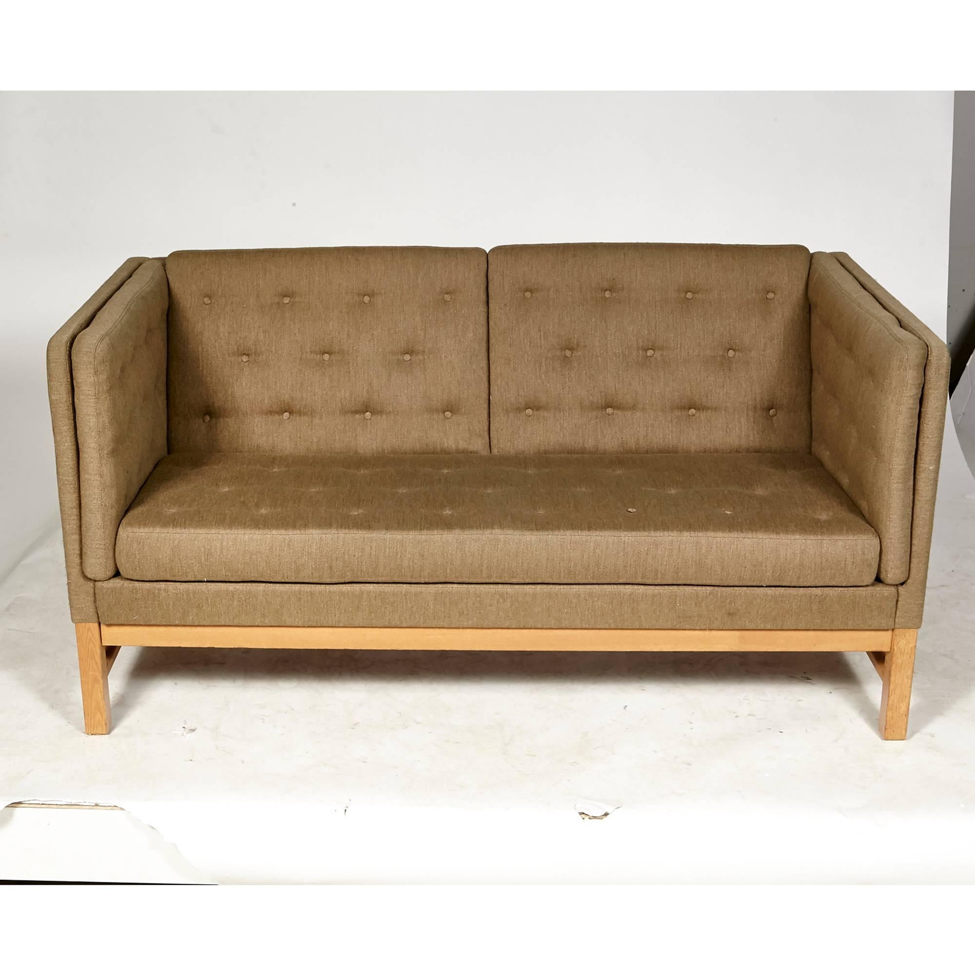 Vintage two-seat tufted sofa in the original olive wool tweed fabric on an oak frame designed by Erik Ole Jørgensen for Svendborg, Denmark, circa mid-1970s. Arm height: 30.5in.