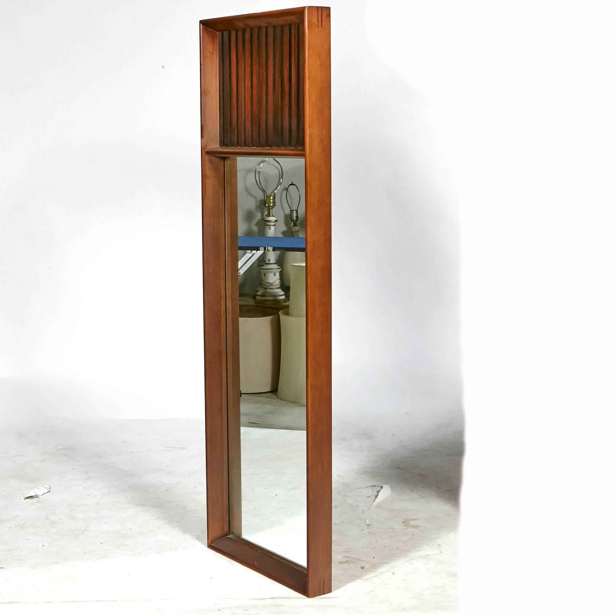 Vintage Mid-Century Modern pair of walnut framed and rosewood accented wall mirrors designed by Lane Furniture Company.