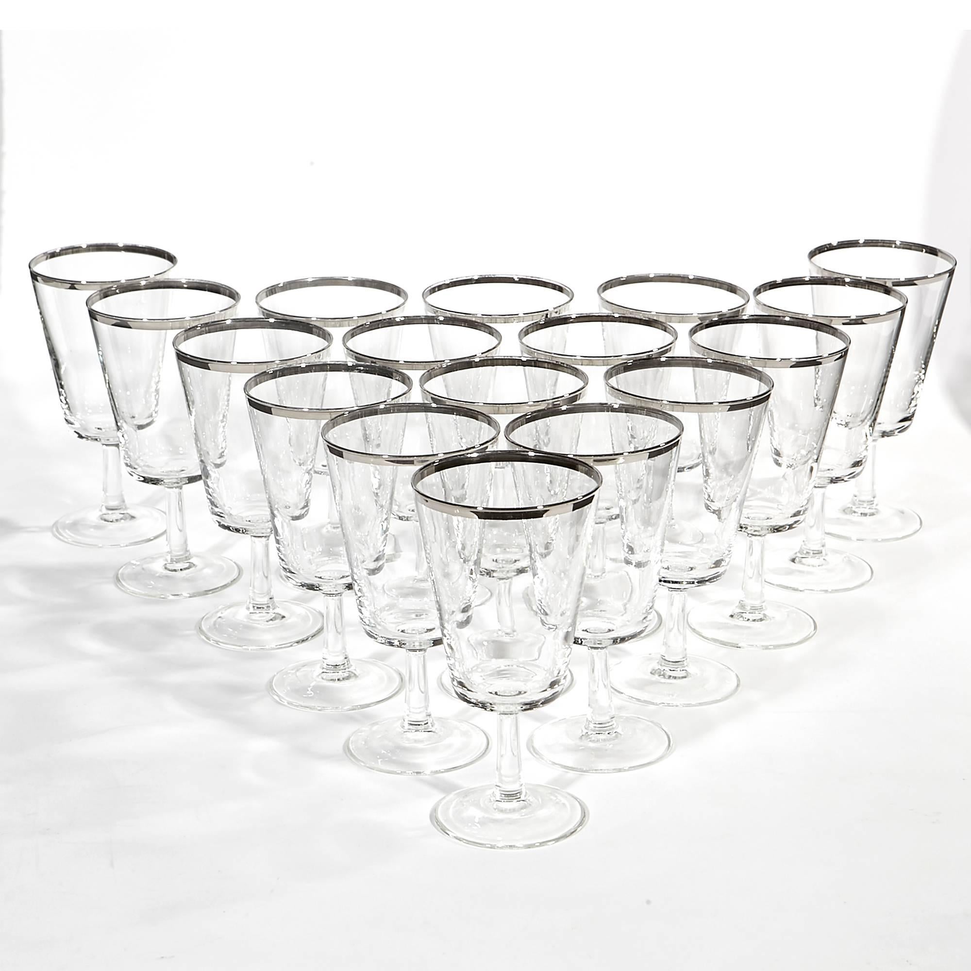 Vintage mid-20th century modern set of 17 silver rimmed tall wine glass stems, circa 1960s. Marked France.