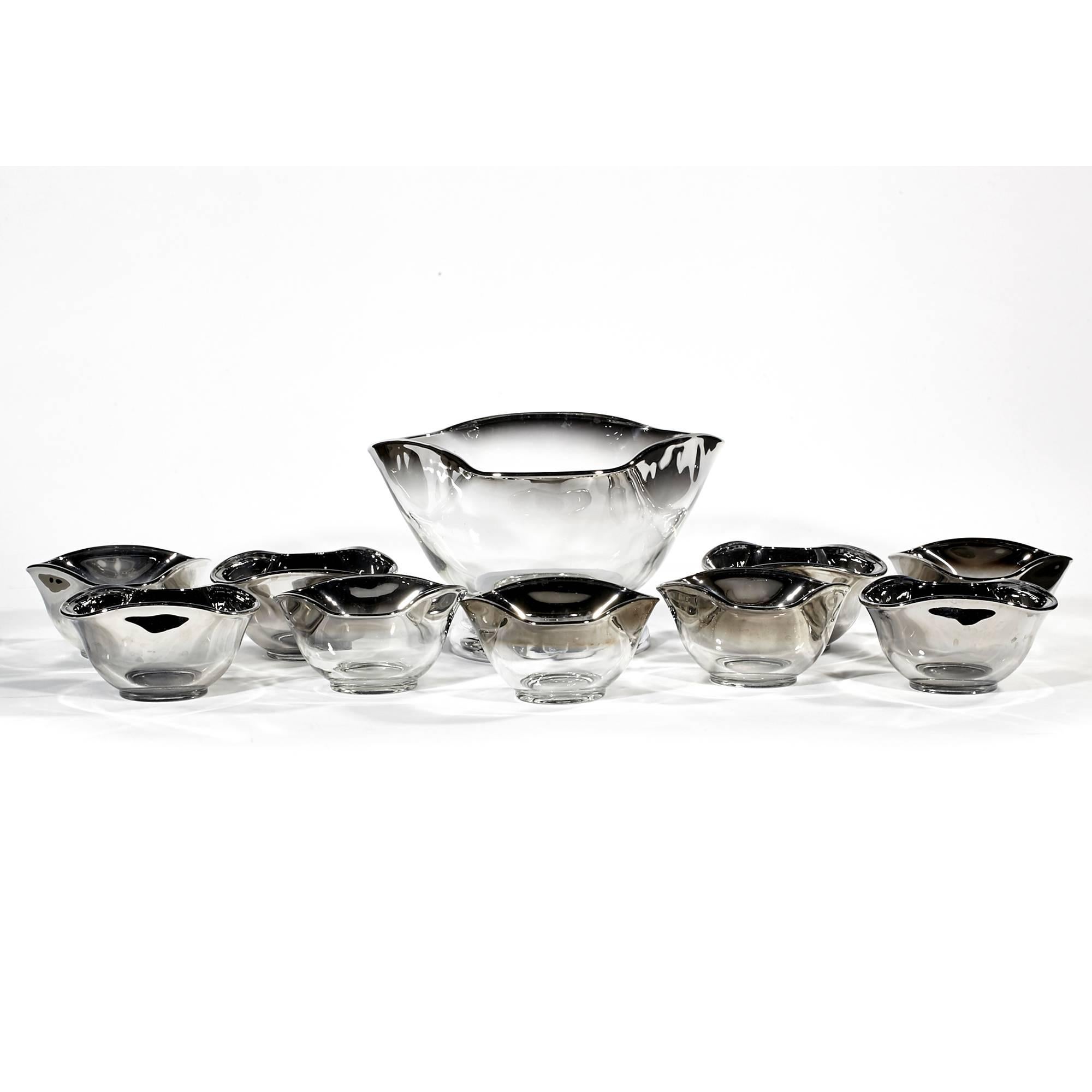 Vintage mid-20th century modern silver fade glass serving bowl set, circa 1960s. The set includes a large chrome base serving bowl and 9 individual bowls. Individual bowls are 5in.D x 3in.H.