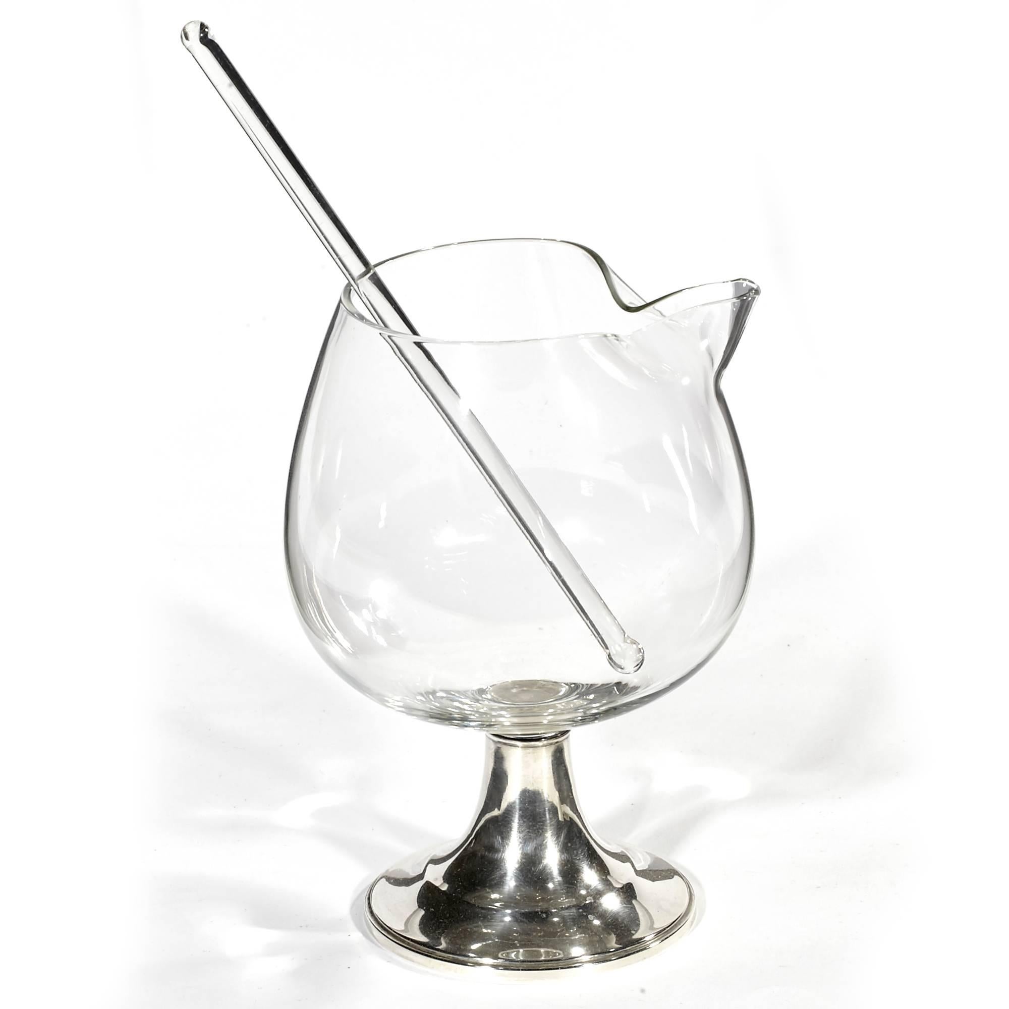 Vintage mid-20th century modern glass bar mixer with a weighted Sterling silver base. Mixer includes glass stirrer. Marked Alvin Sterling. Stirrer is 8in.L.