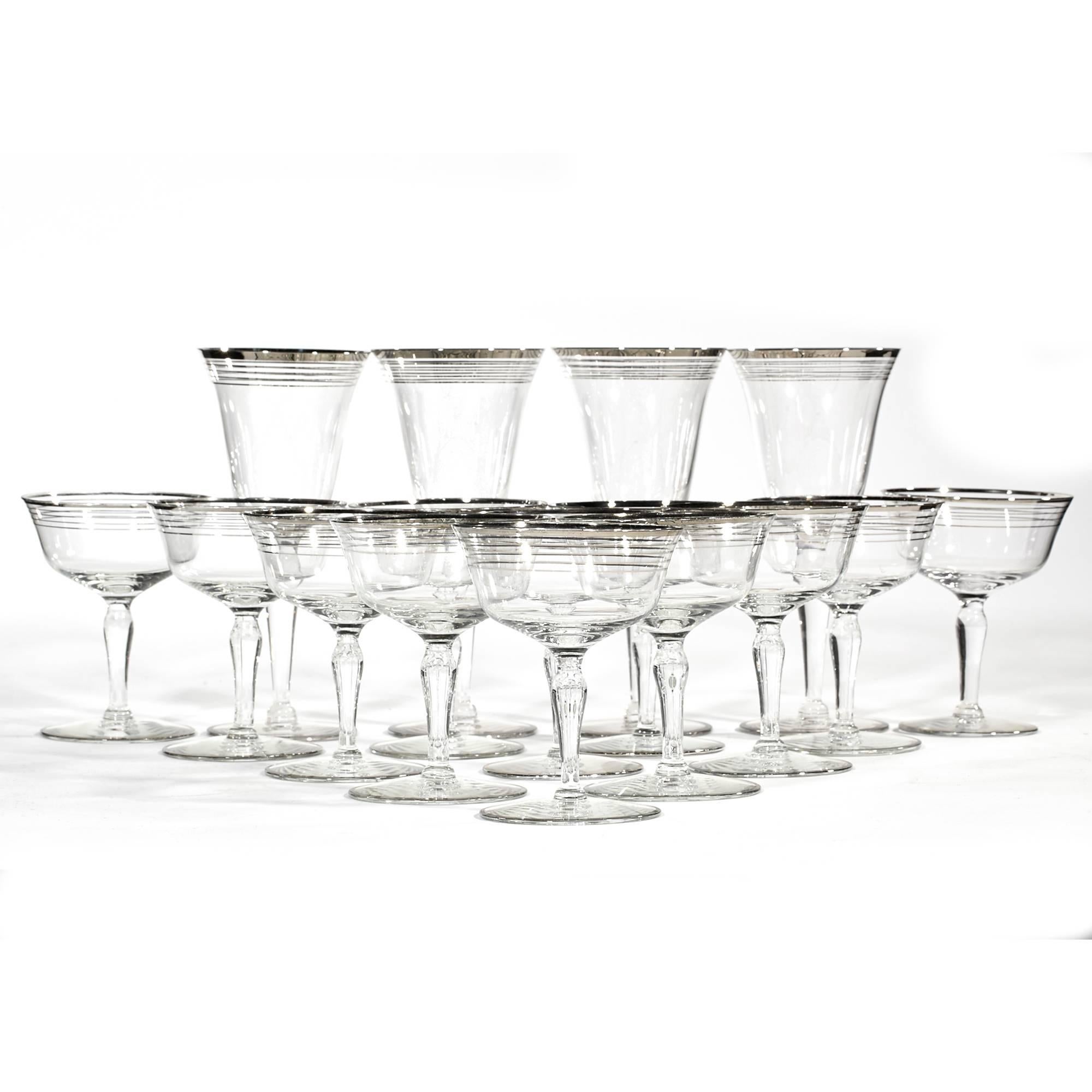 Vintage Art Deco set of 15 silver ring glass stems, circa 1930s.
4-tall wines measures: 3.5in.D x 7.5in.H
11-coupe stems 3.75in.D x 4.75in.H.