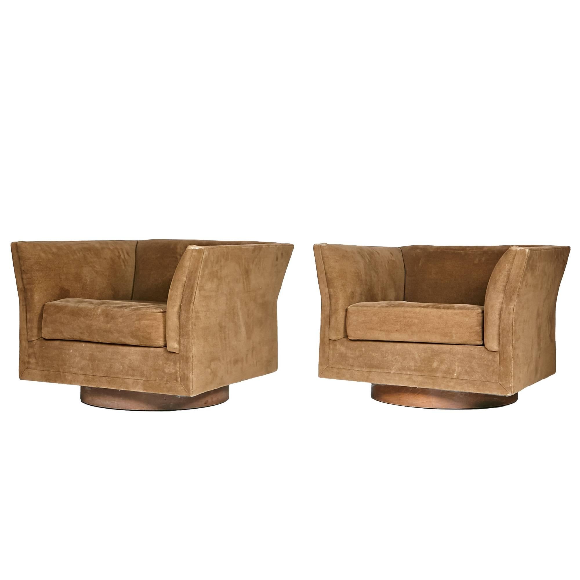 Pair of 1970s Selig walnut base swivel lounge chairs with the original chenille upholstery. The chair backs are curved for seating comfort. The upholstery is in very good condition with wear to the arm edges. New upholstery is recommended. Marked.