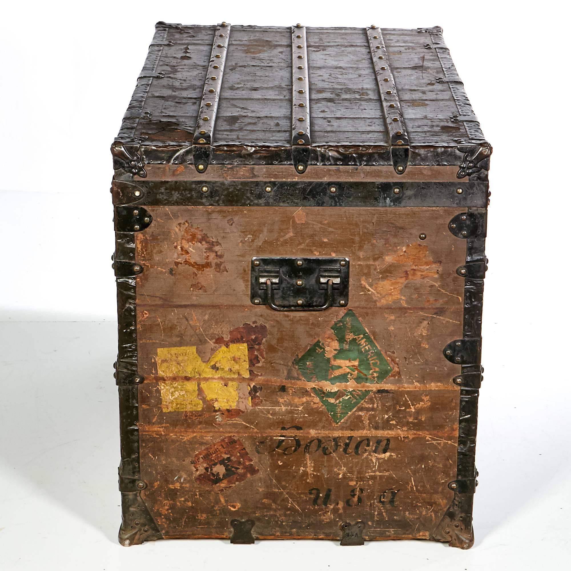 Late 1800s large Louis Vuitton steamer trunk with monogrammed LV hardware and paper label inside. Features the five digit Serial number with the London 454 Strand marked on paper label. Trunk is made of wood and metal hardware accents. Multiple