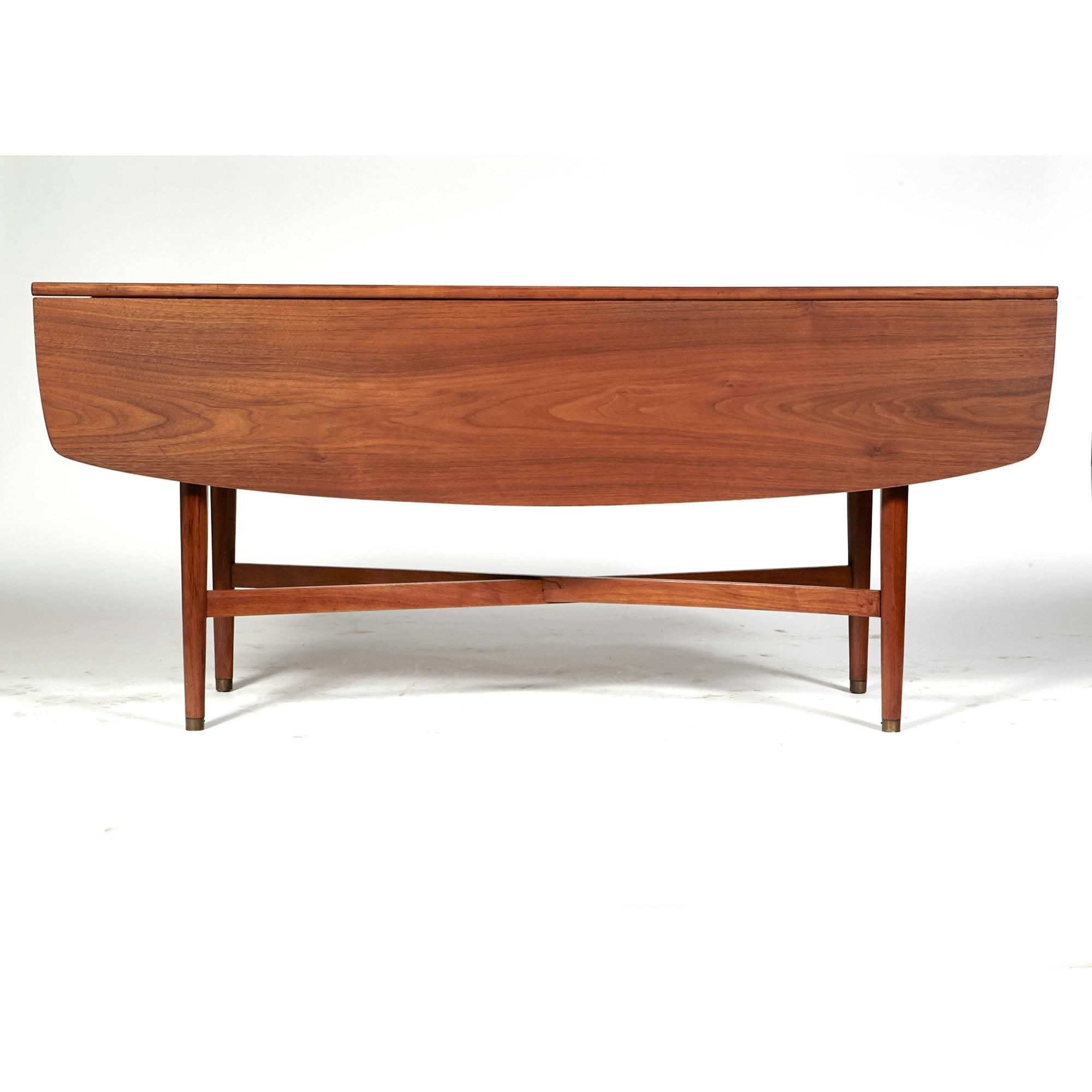 Vintage Drexel declaration Model 851-311 walnut drop-leaf X-stretcher base sofa table designed by Kipp Stewart and Stewart MacDougall, dated 1964. Refinished condition. Open, 42