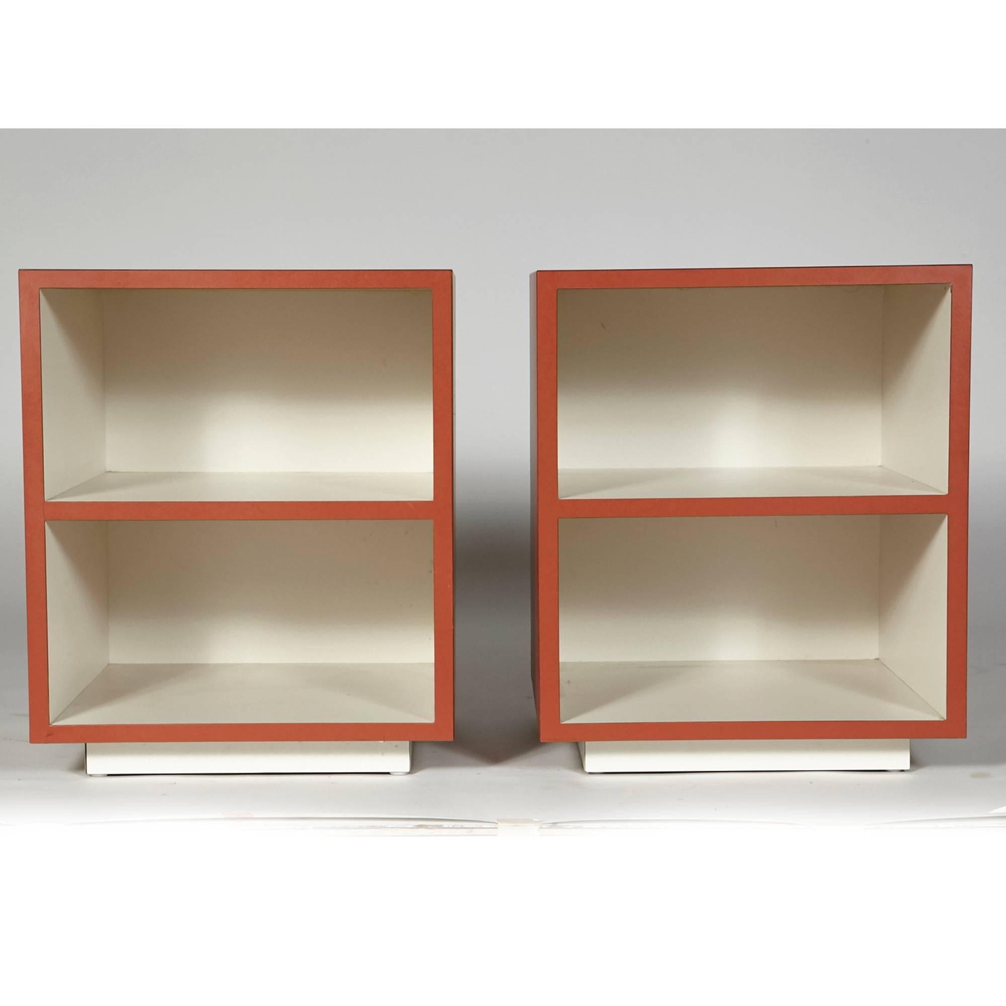 Vintage pair of orange and white laminated open storage cube side tables, circa 1970s. Excellent condition. Unmarked.