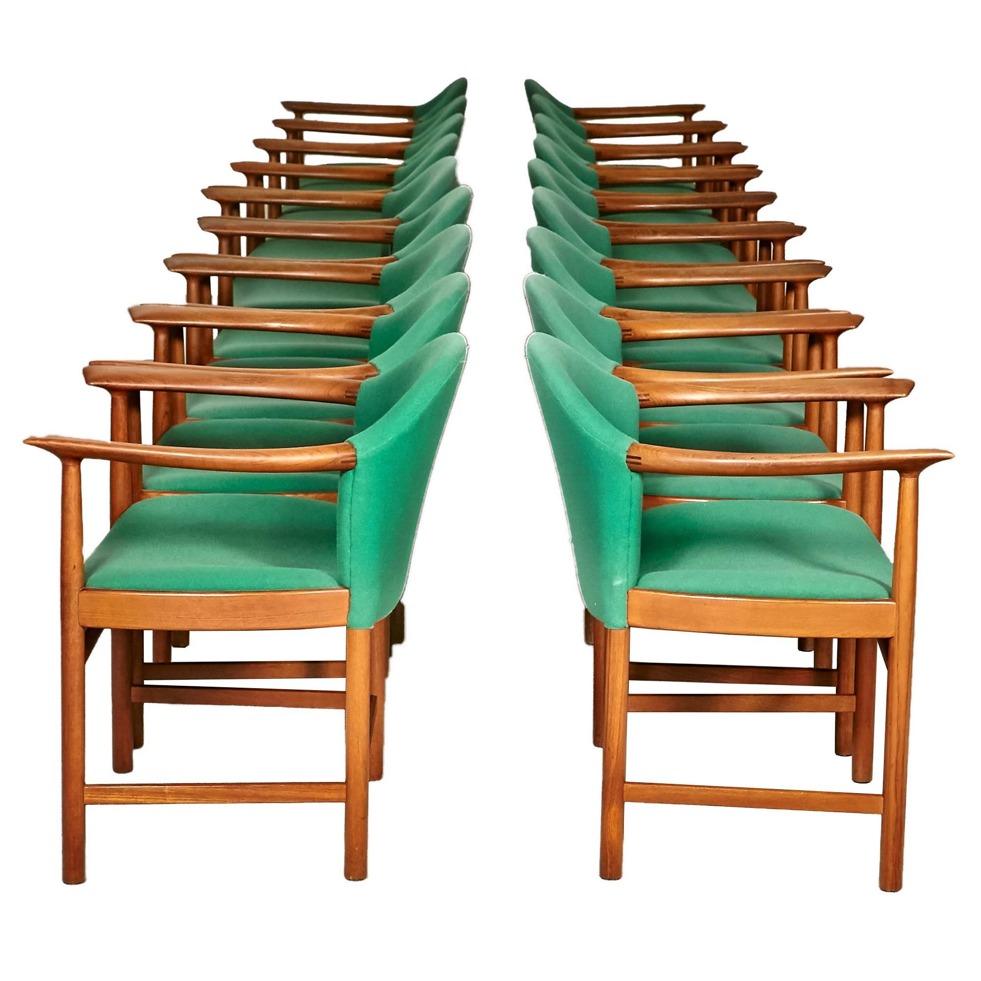 Vintage set of 16 Danish teak rare dining or conference chairs designed by Peter Hvidt. Sculpted teak arms are 27in.H. Price is per piece.