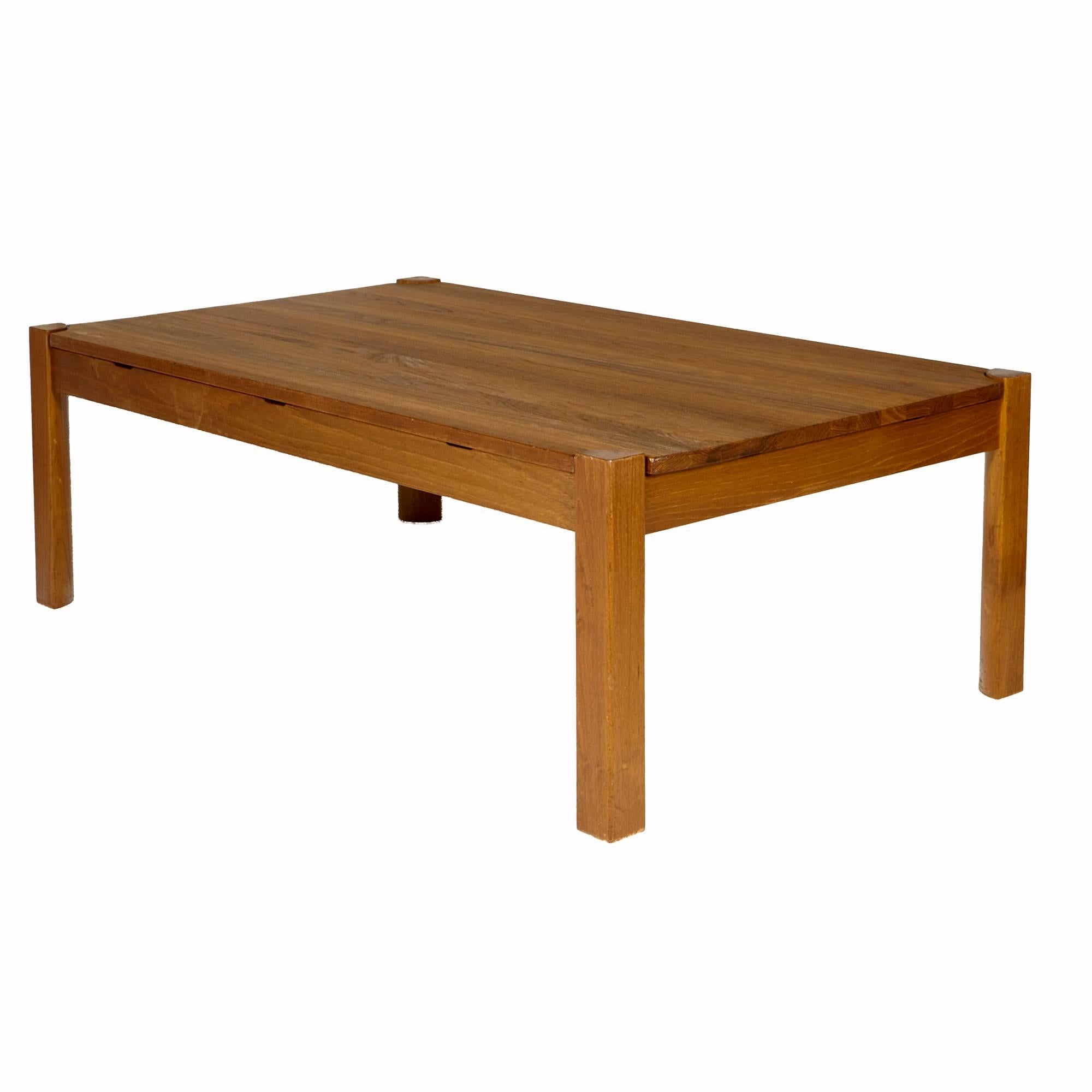 Vintage 1960s solid teak Danish coffee table with a reversible top. The table is in refinished condition. Unmarked.