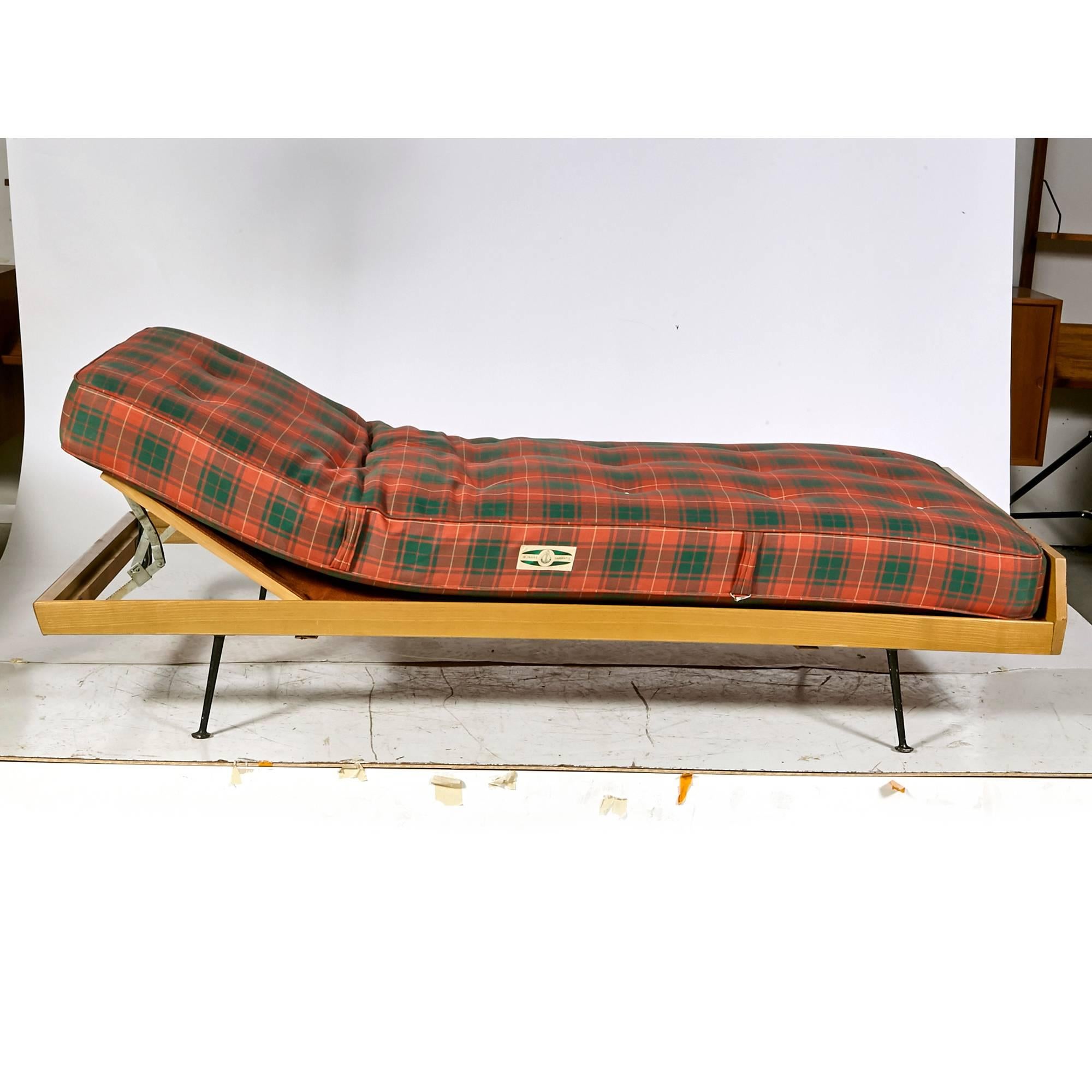 Vintage German daybed with original mattress on thin slanted black metal legs. The daybed tilts up or remains flat. Daybed is unmarked but attributed to 
WK Möbel of Germany. Mattress is marked. In original condition.

Measure: Bed 10.5
